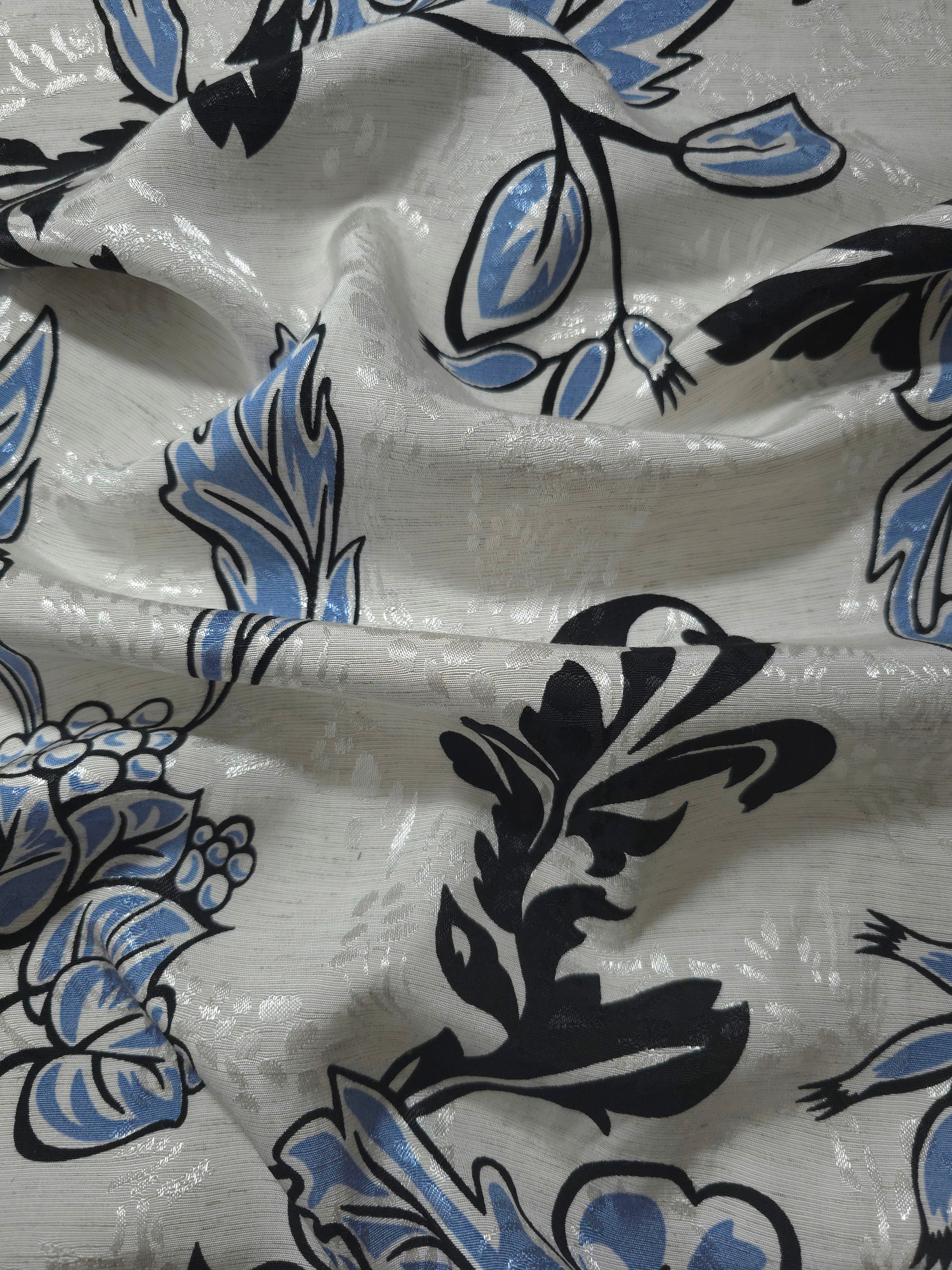Blue sketch floral linen-look jacquard fabric draped to show soft body and tonal floral pattern.
