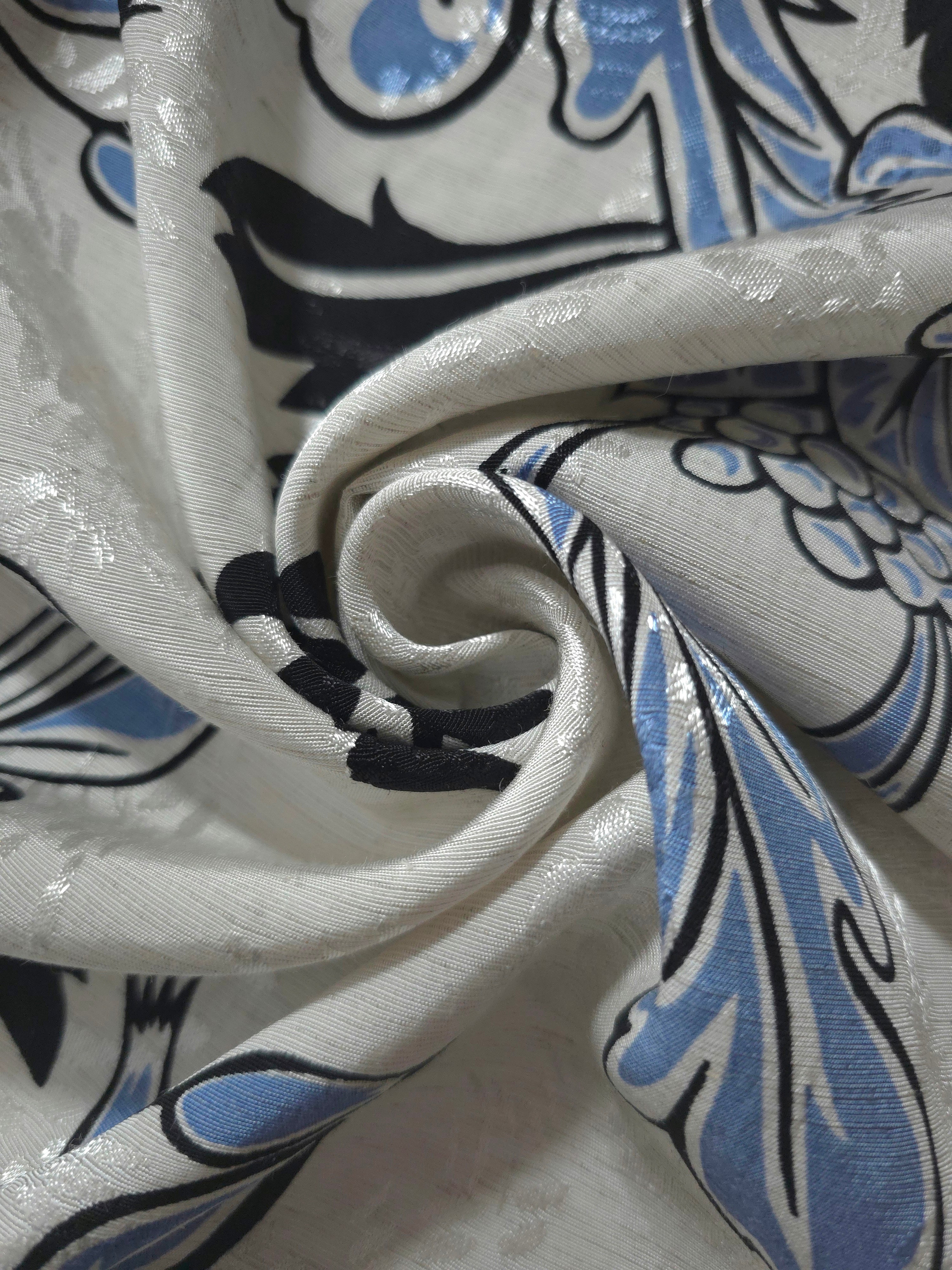 Blue sketch floral linen-look jacquard fabric folded view showing apparel drape and woven texture.