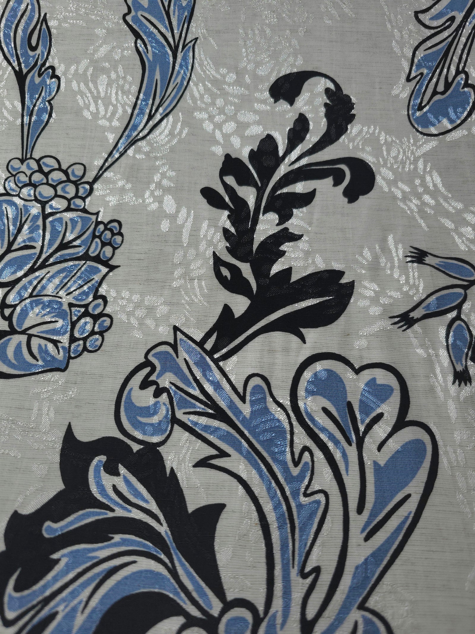 Blue sketch floral linen-look jacquard fabric pattern overview with tonal flower and branch motif.