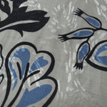 Texture view of blue sketch floral jacquard fabric with woven floral design.