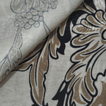 Brown sketch floral jacquard fabric close-up detail showing woven flower texture.