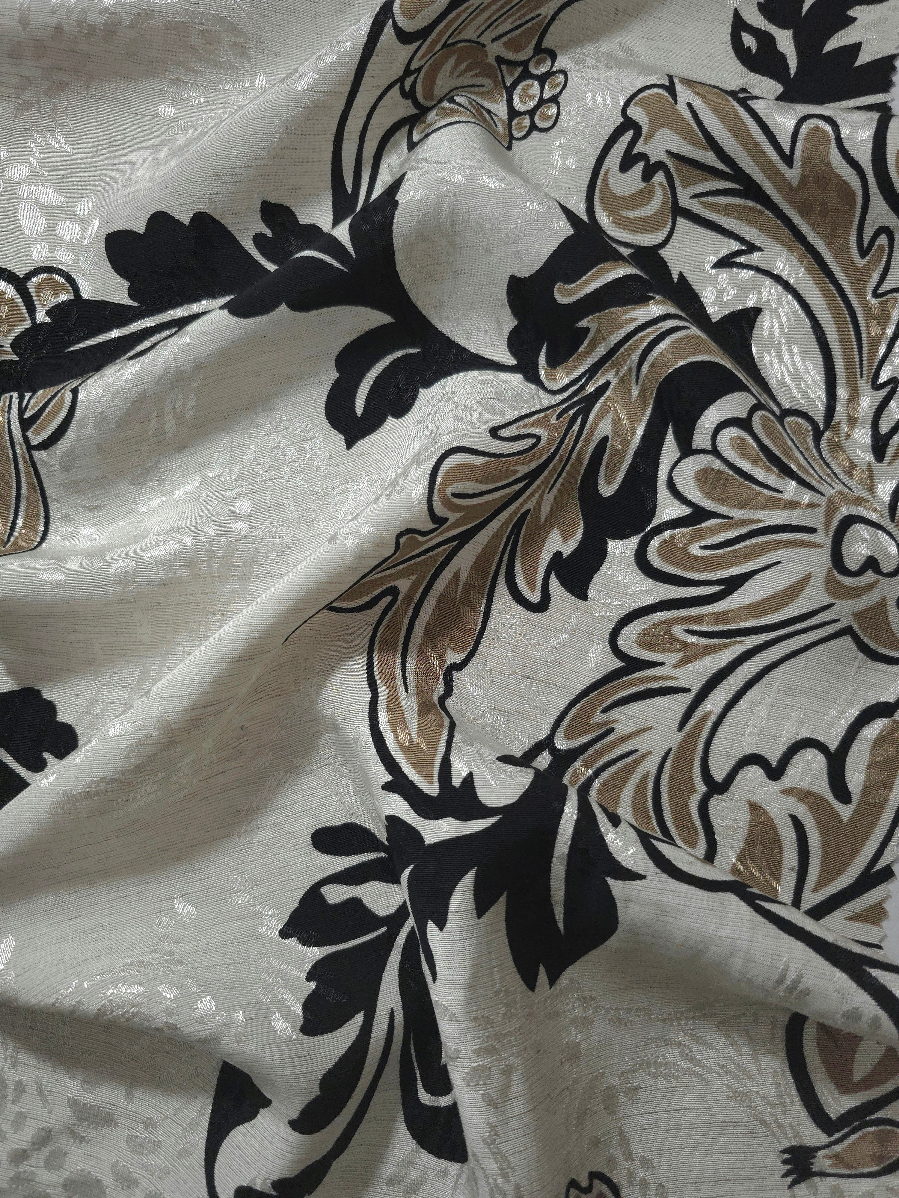 Brown sketch floral linen-look jacquard fabric draped to show soft structure and floral pattern depth.