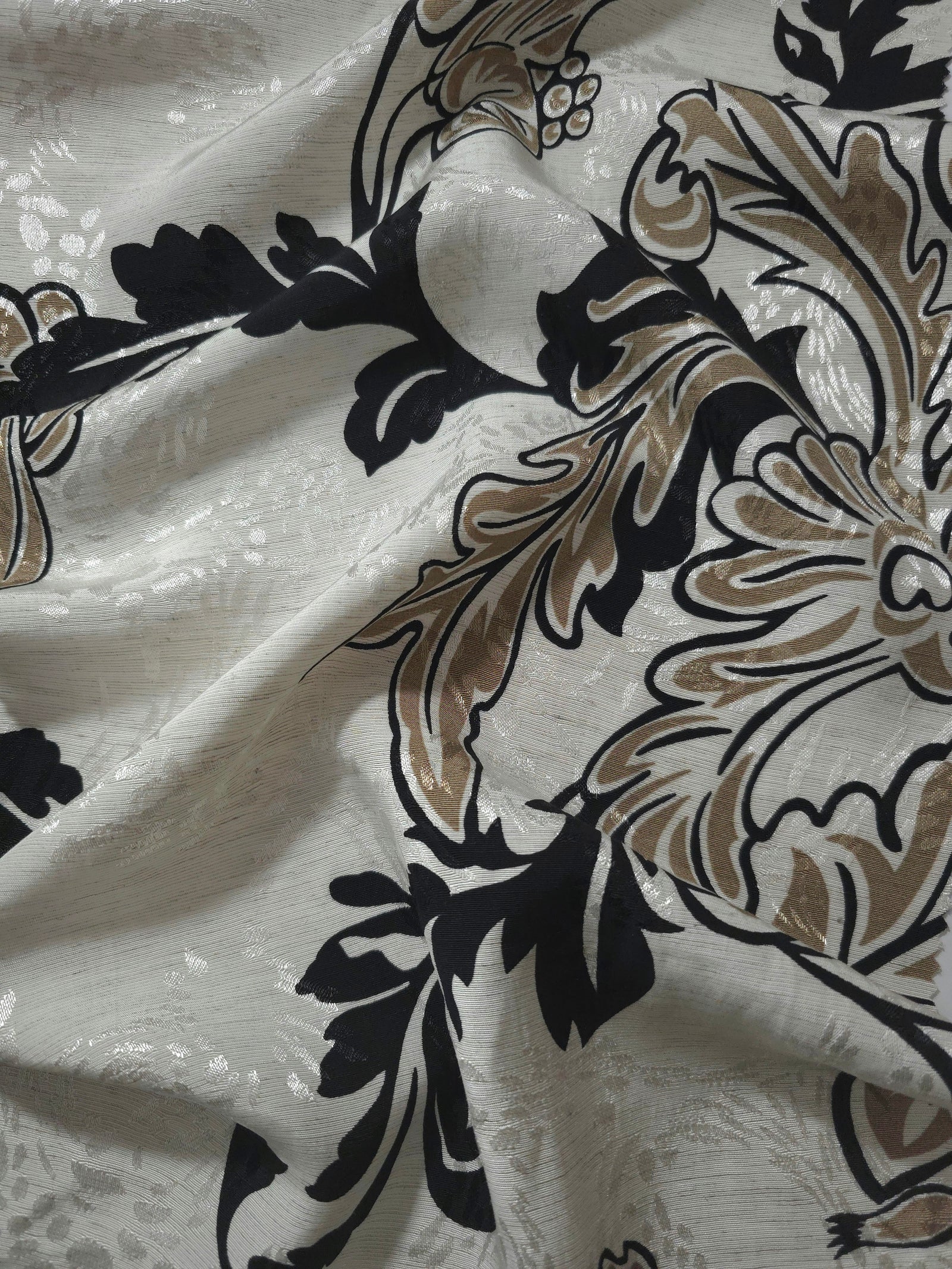 Brown sketch floral linen-look jacquard fabric draped to show soft structure and floral pattern depth.
