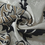Brown sketch floral linen-look jacquard fabric folded view showing body, texture and drape.