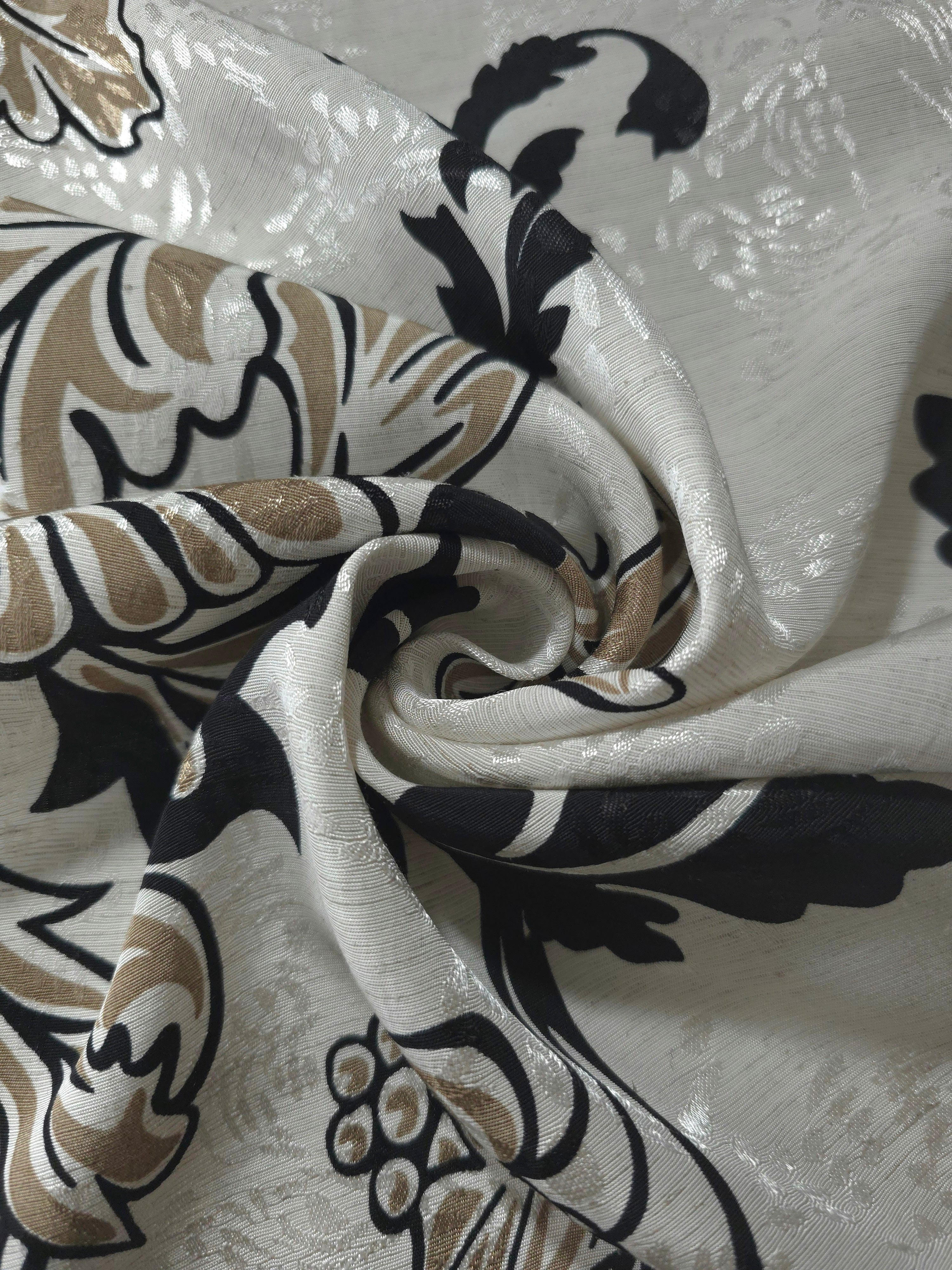 Brown sketch floral linen-look jacquard fabric folded view showing body, texture and drape.
