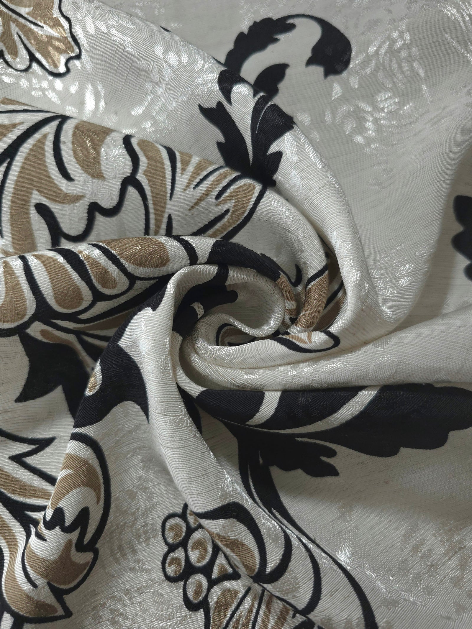 Brown sketch floral linen-look jacquard fabric folded view showing body, texture and drape.