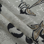 Reverse side of brown sketch floral jacquard fabric showing woven construction and textured finish.