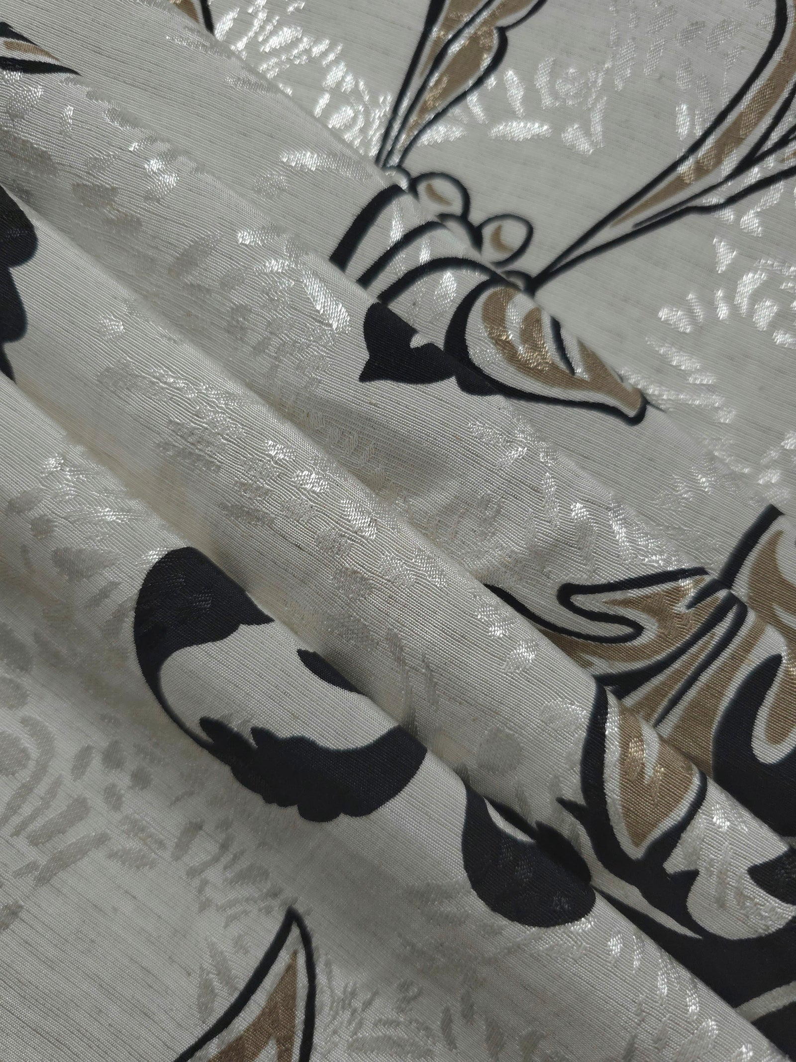 Reverse side of brown sketch floral jacquard fabric showing woven construction and textured finish.