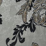 Texture view of brown sketch floral jacquard fabric with woven floral motif.