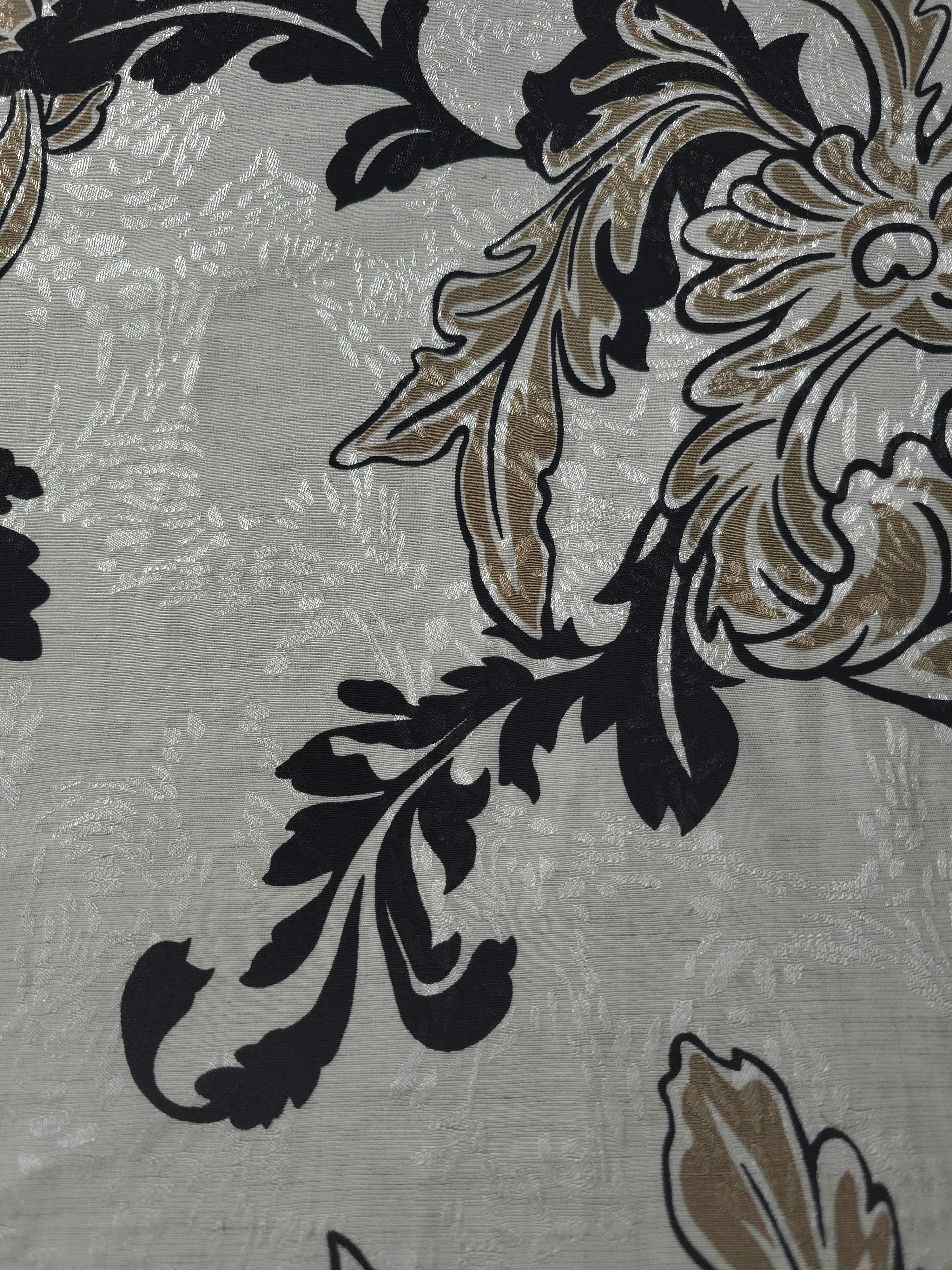 Texture view of brown sketch floral jacquard fabric with woven floral motif.