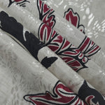 Reverse side of deep red sketch floral jacquard fabric showing woven construction and texture.