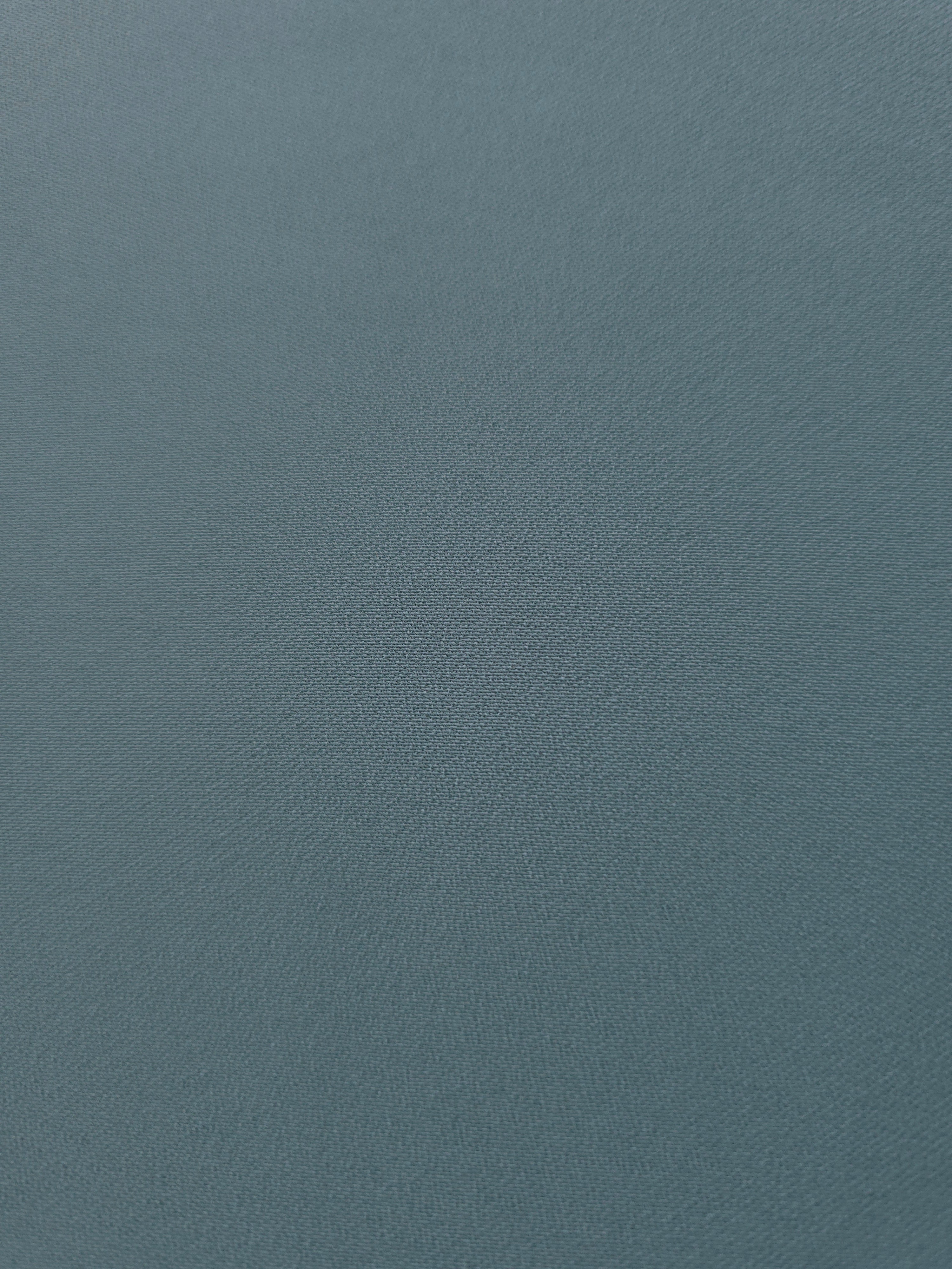 Fine texture close-up of Slate Blue Gray mechanical polyester crepe showing a smooth silky-soft woven hand