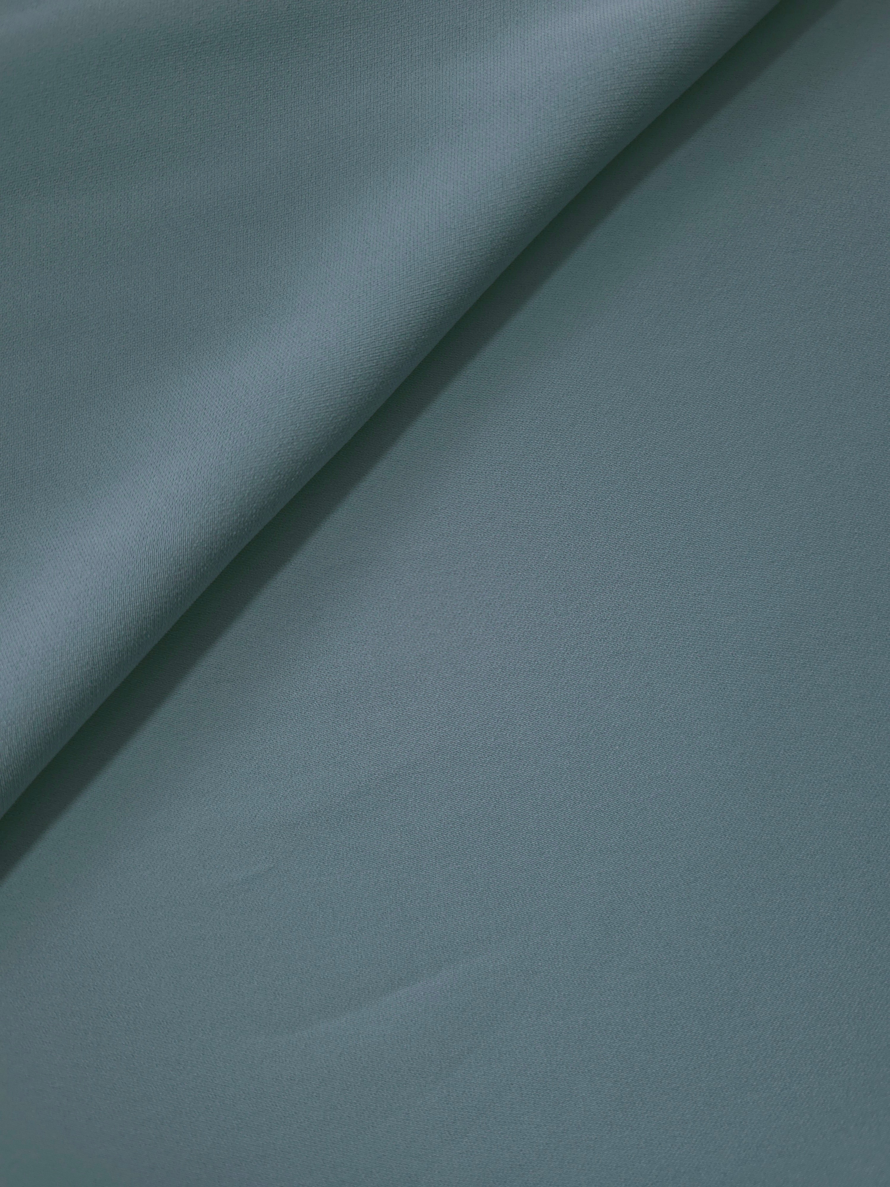 Soft-fold view of Slate Blue Gray polyester crepe showing fluid drape for dresses, skirts and blouse making