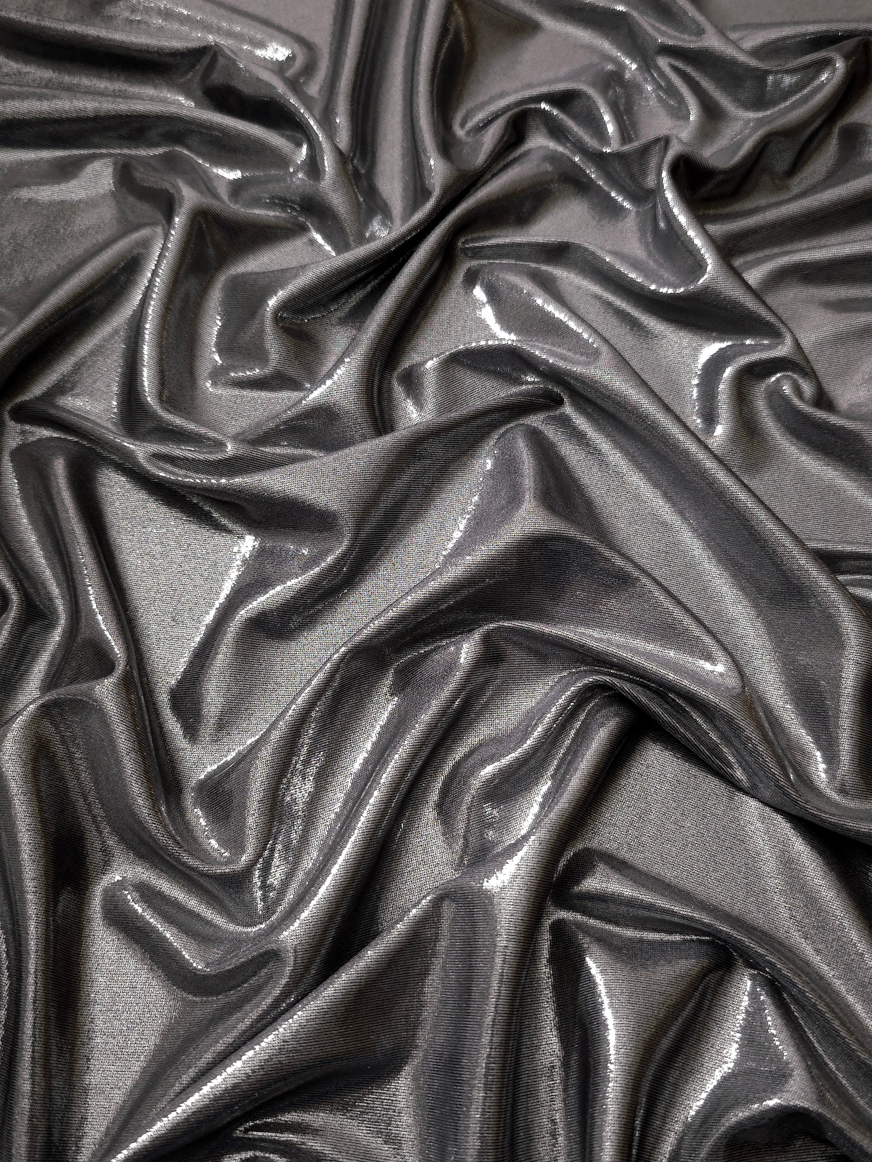 Smoky Gray metallic stretch fabric arranged in elegant folds, showing reflective movement for occasionwear, costumes and fashion design