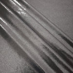 Layered Smoky Gray metallic stretch fabric with reflective foil finish, showing flexible body for dancewear and occasion fashion