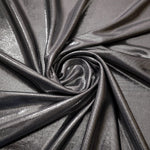 Smoky Gray foiled spandex styled in a swirl, revealing metallic shine and flexible drape for dance costumes and occasion looks