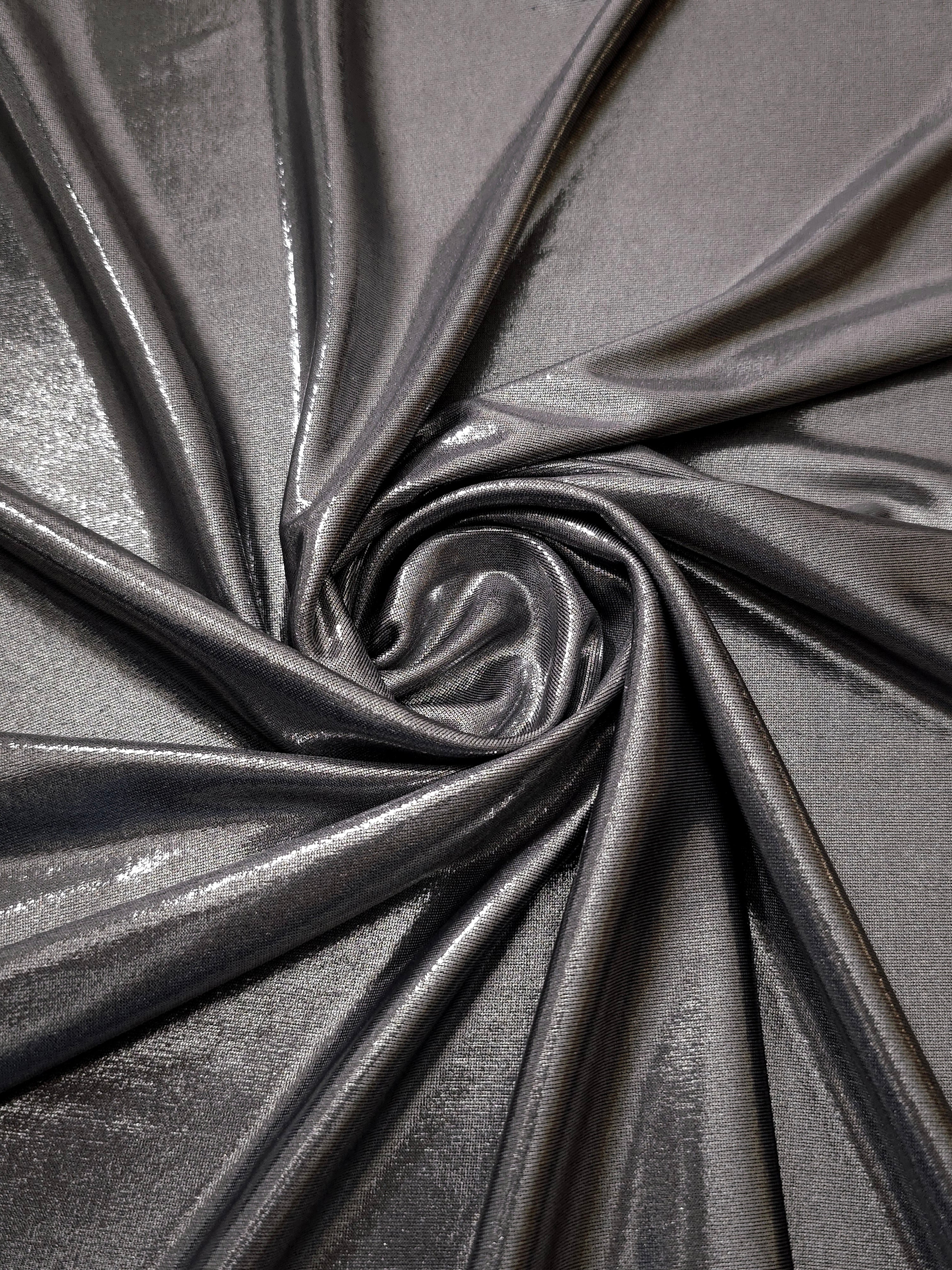 Smoky Gray foiled spandex styled in a swirl, revealing metallic shine and flexible drape for dance costumes and occasion looks