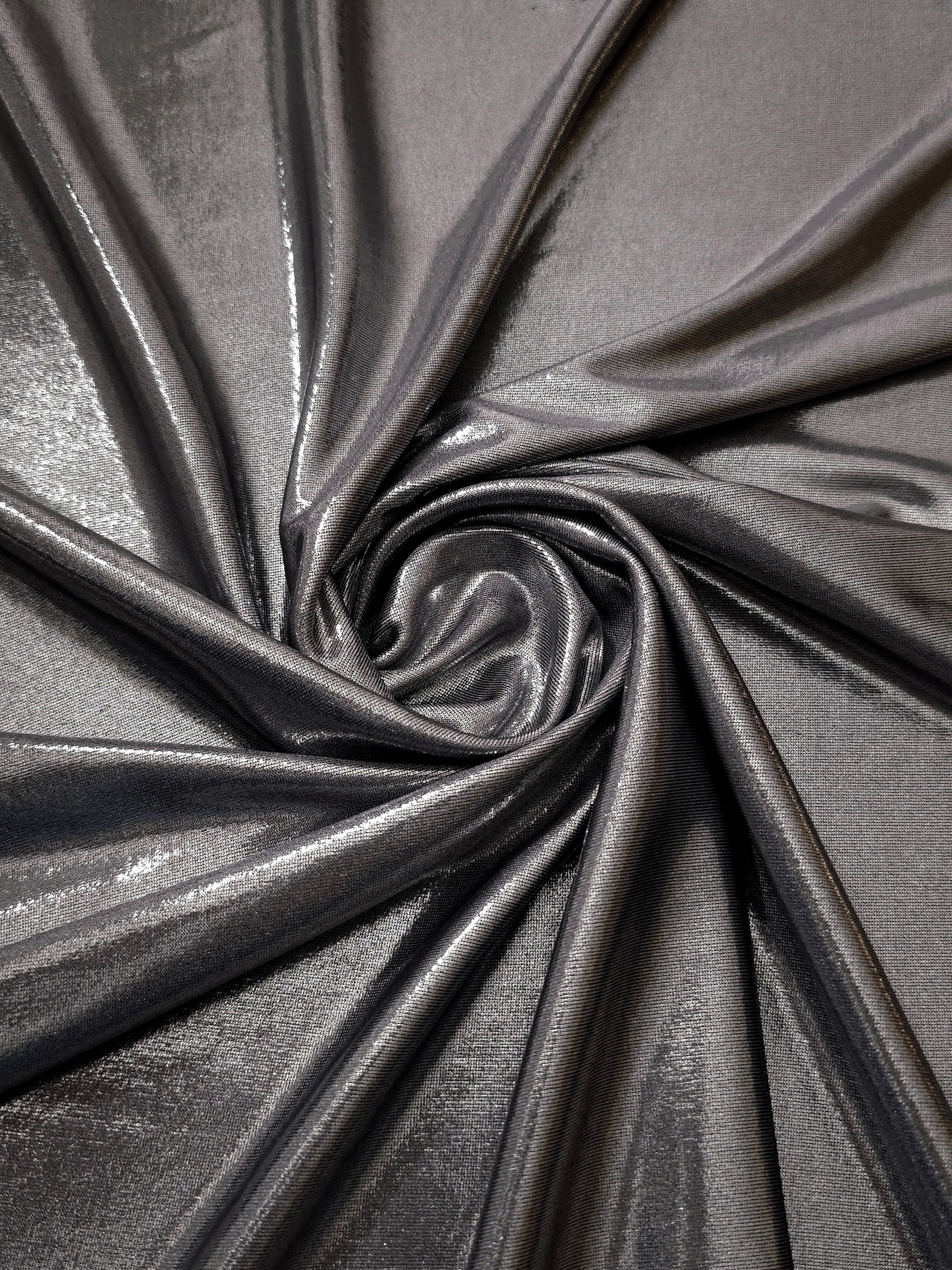 Smoky Gray foiled spandex styled in a swirl, revealing metallic shine and flexible drape for dance costumes and occasion looks