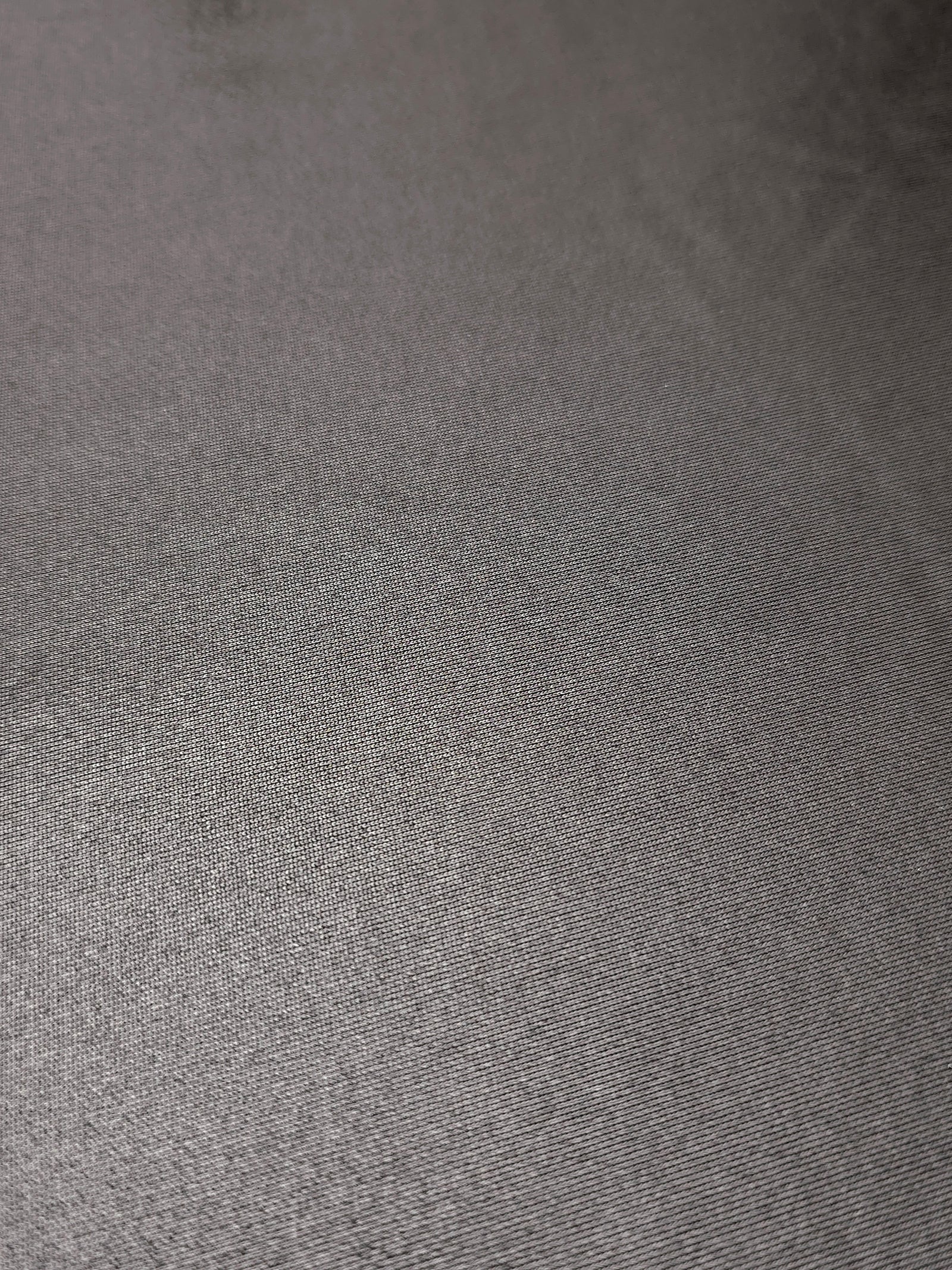 Close-up Smoky Gray shimmer metallic spandex showing reflective foil detail and the fabric surface for statement garments