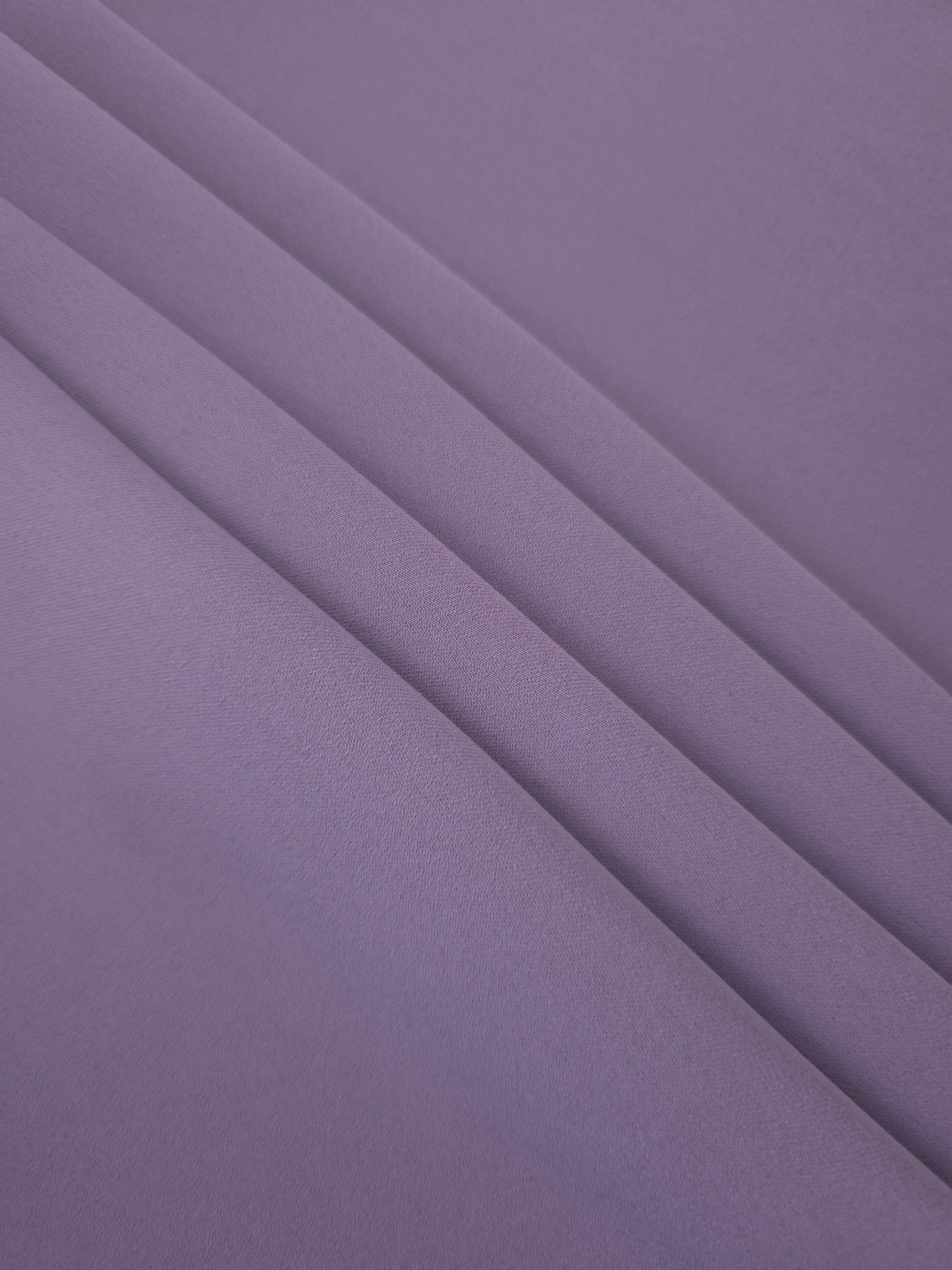 Smoky Lavender mechanical polyester crepe layered to show soft structure for tailored garments and separates