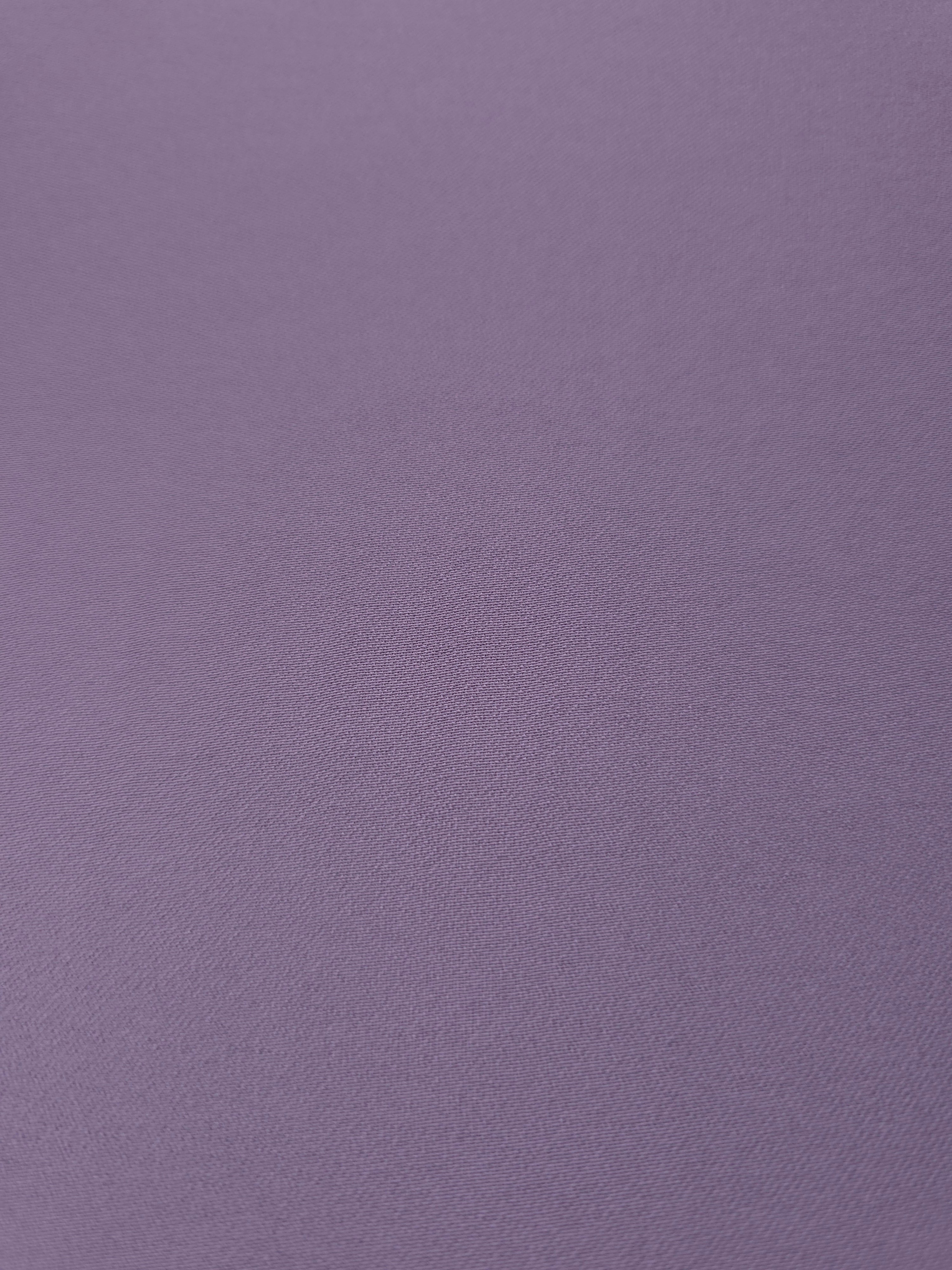 Close woven detail of Smoky Lavender 100% polyester Korean crepe showing its smooth texture and soft finish