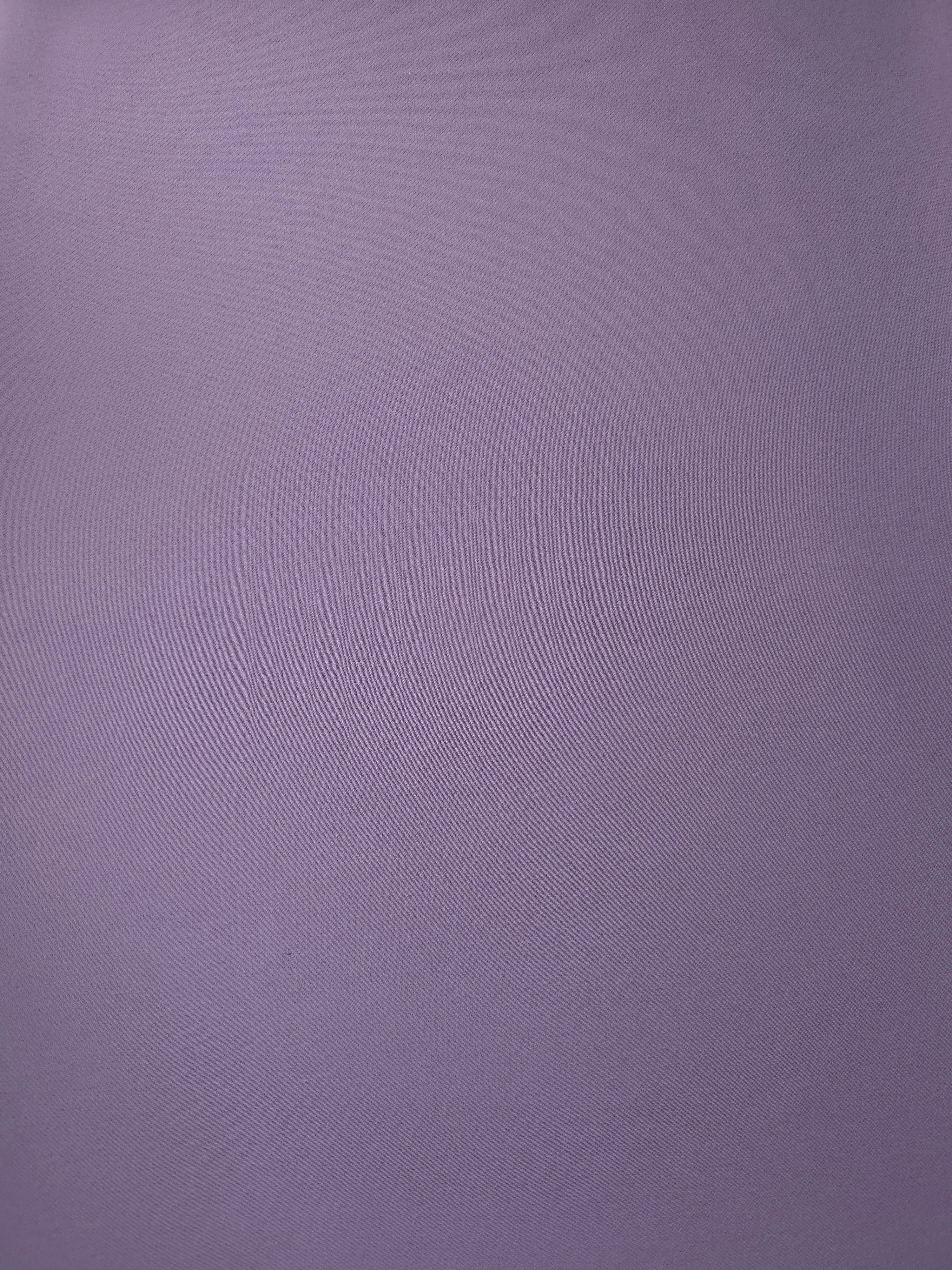 Surface view of Smoky Lavender 205 GSM polyester crepe, opaque Korean dress fabric with a smooth woven finish