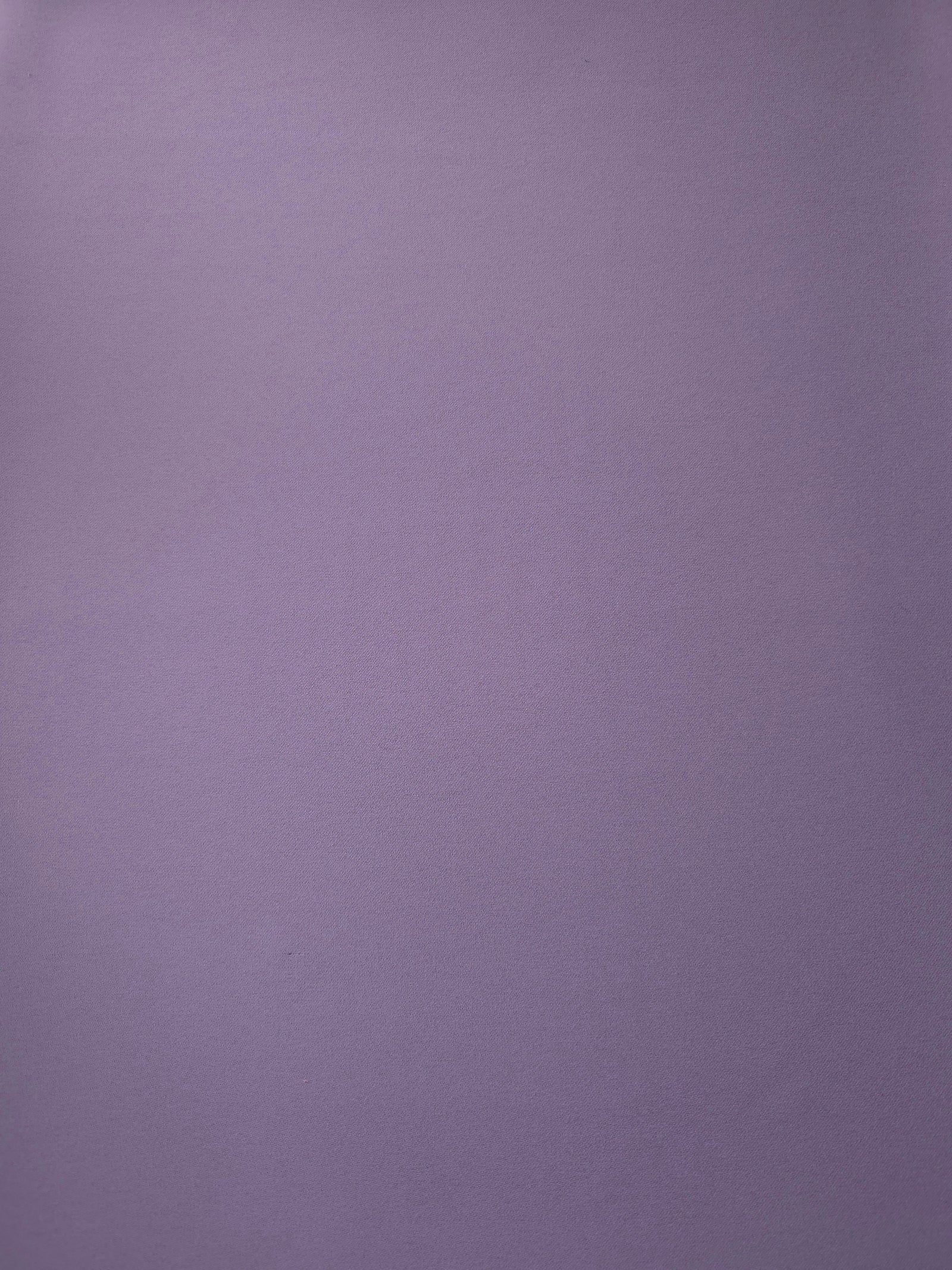 Surface view of Smoky Lavender 205 GSM polyester crepe, opaque Korean dress fabric with a smooth woven finish