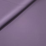 Loose fold of Smoky Lavender polyester crepe showing smooth fluid drape for dresses, skirts and soft tailoring