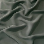 Smoky Sage Green polyester crepe in long draped folds, showing flowing coverage for abayas and modest fashion