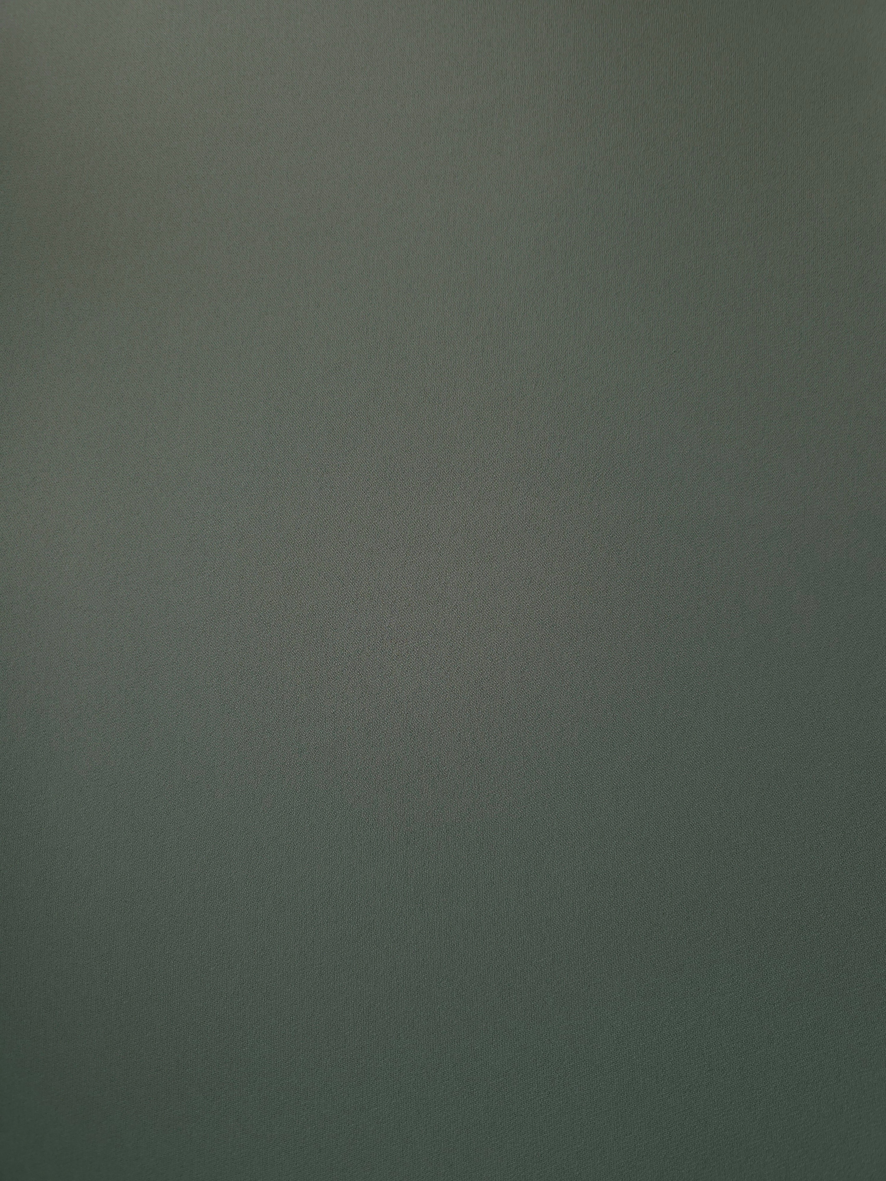 Flat view of Smoky Sage Green Korean polyester crepe, 205 GSM opaque dressmaking fabric with a smooth woven surface
