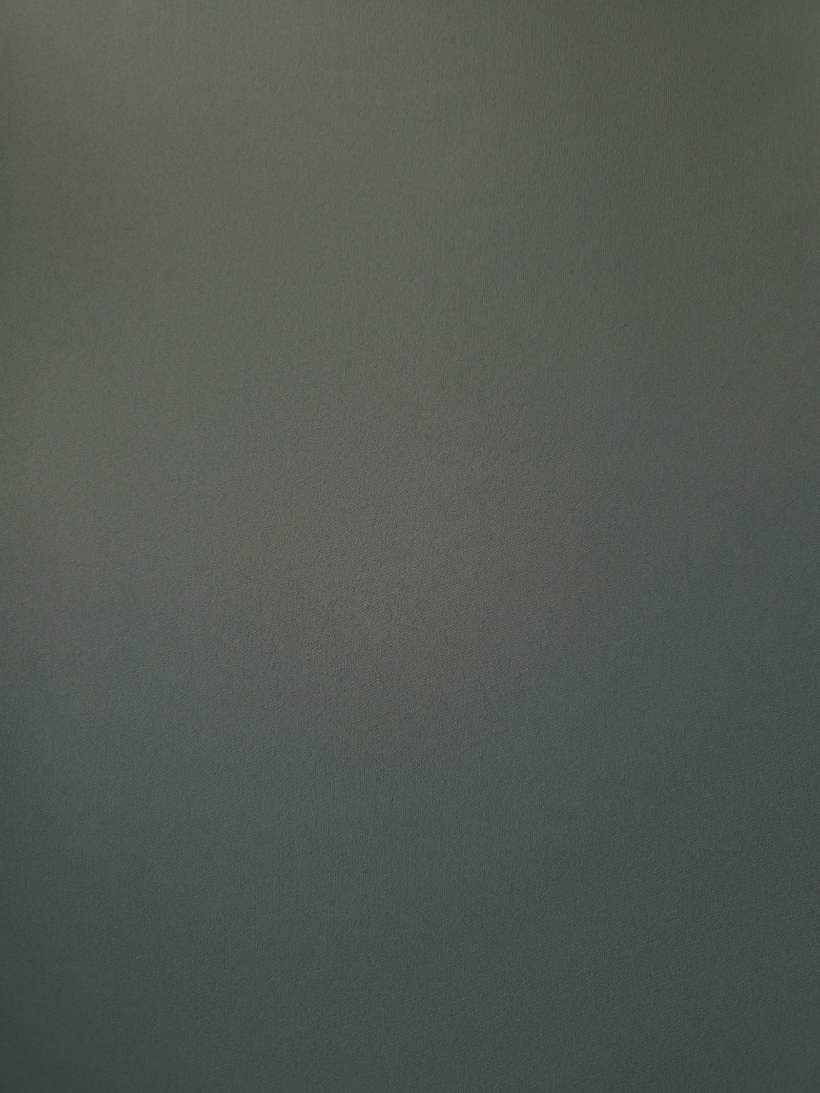 Flat view of Smoky Sage Green Korean polyester crepe, 205 GSM opaque dressmaking fabric with a smooth woven surface
