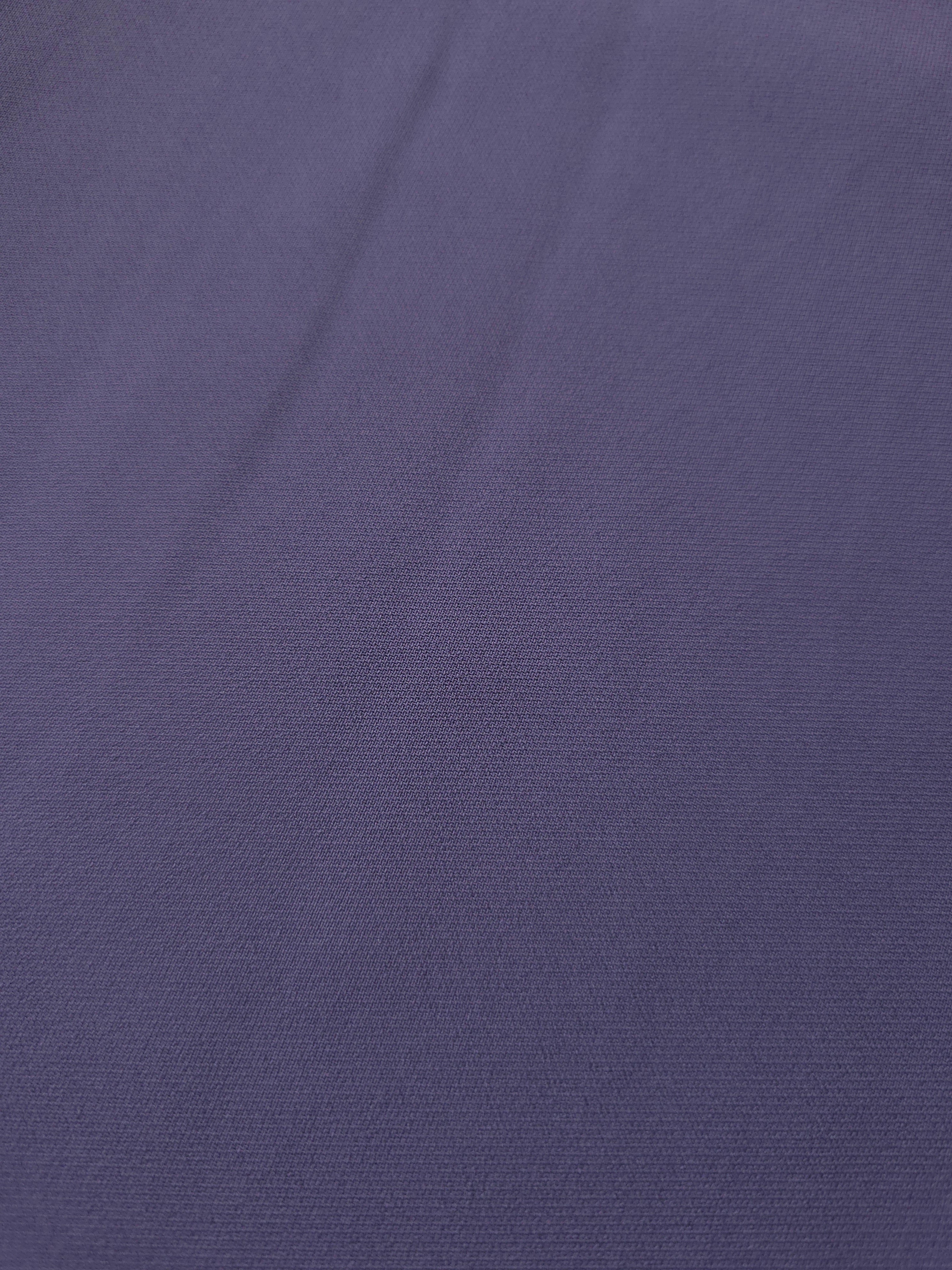 Close-up of Smoky Violet Purple mechanical polyester crepe showing fine woven texture and a silky-soft hand