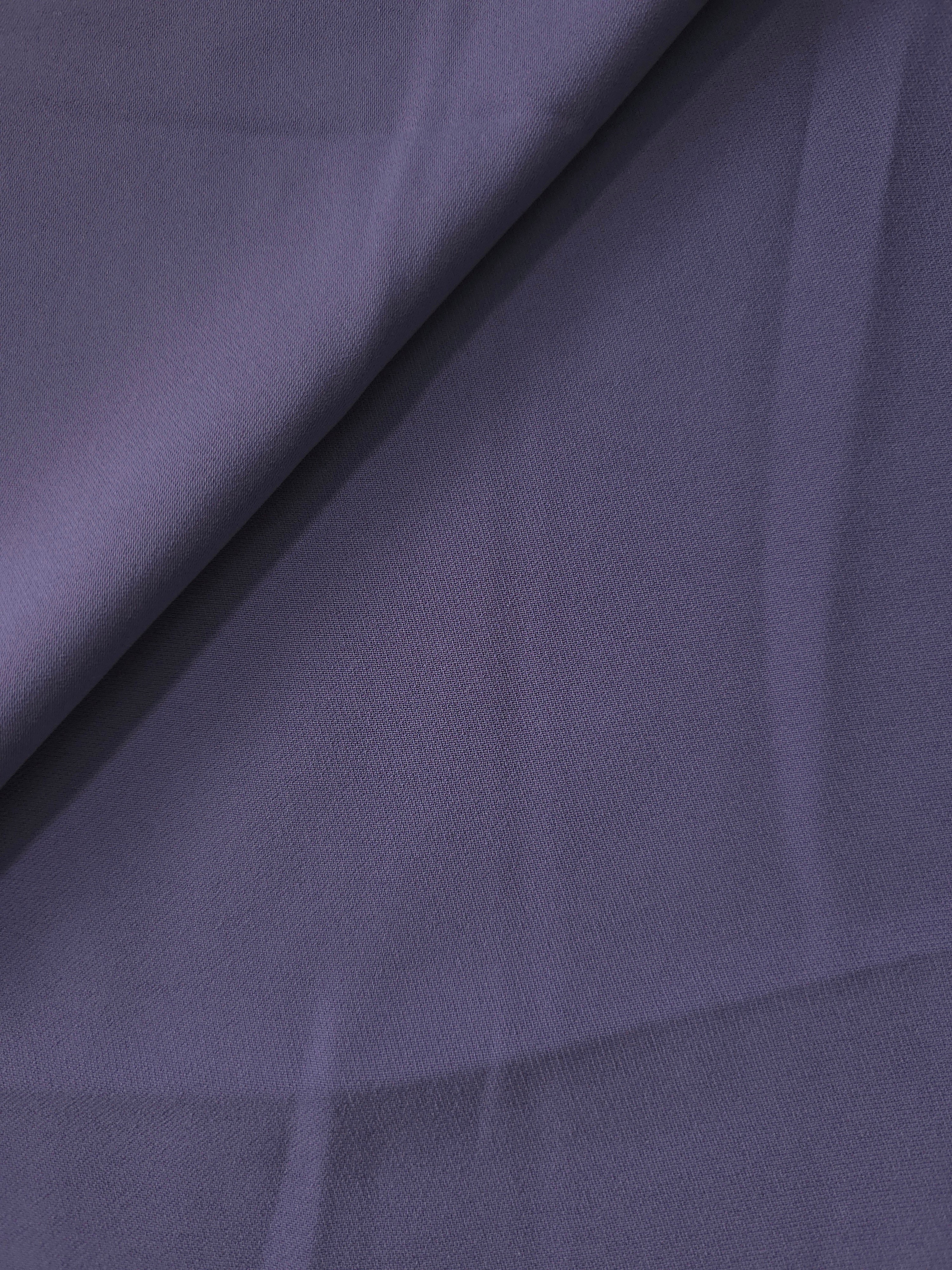 Smoky Violet Purple crepe in a soft fold, showing fluid drape for dresses, blouses and flowing skirts