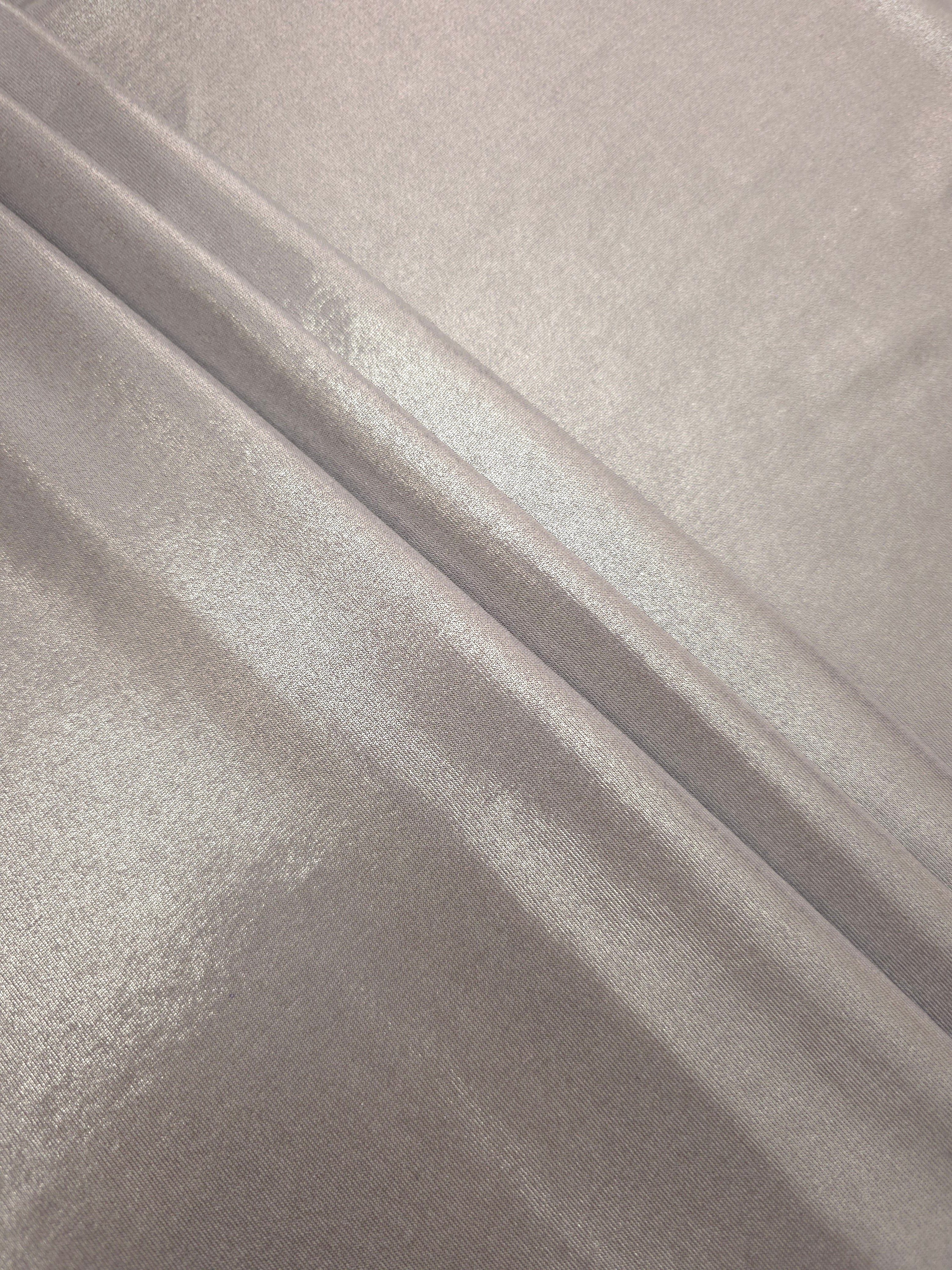 Layered Soft Silver Gray shimmer stretch fabric showing metallic foil depth and soft structure for costumes, skirts and fashion apparel
