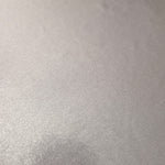 Close-up of Soft Silver Gray metallic foiled spandex showing reflective surface texture and the detailed shimmer finish