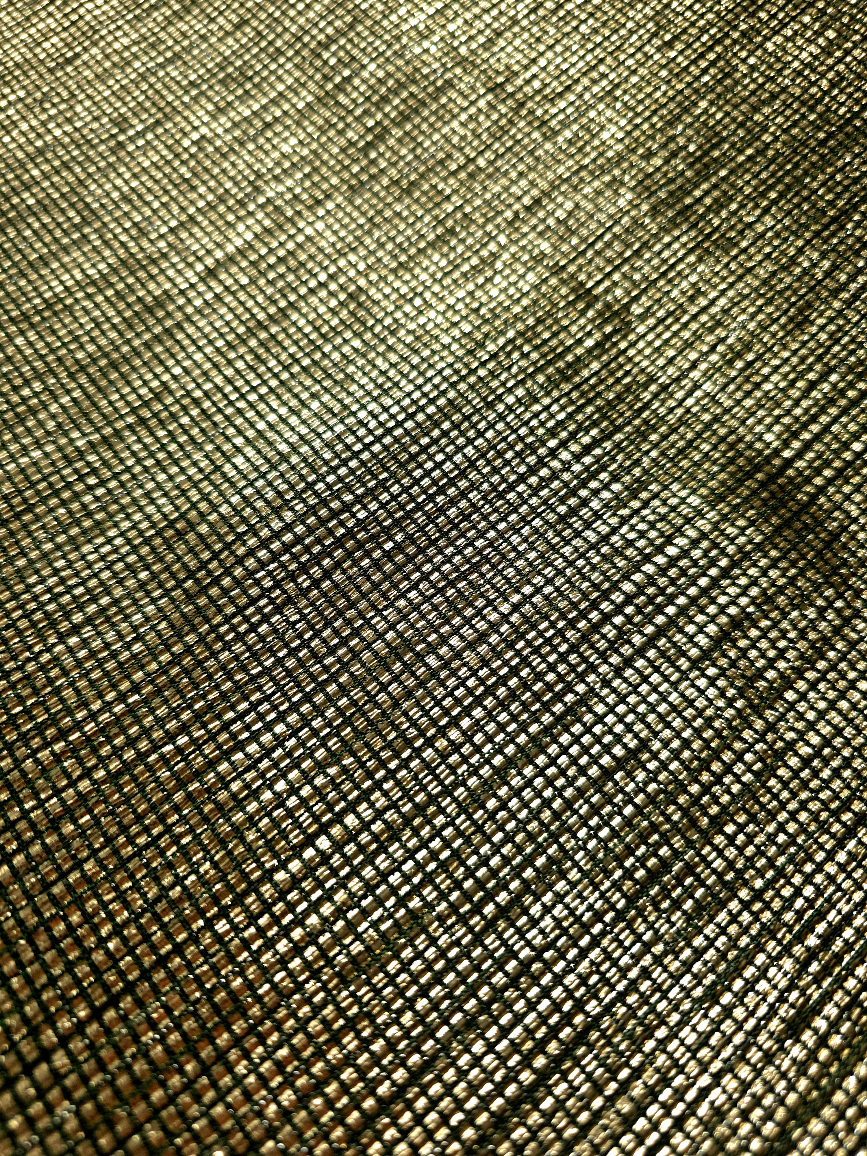 Close-up of Antique Gold Sheer Square Shimmer Stretch Tulle Fabric revealing the square shimmer repeat and fine transparent mesh