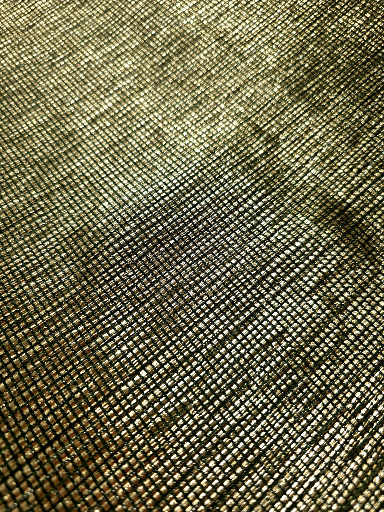 Close-up of Antique Gold Sheer Square Shimmer Stretch Tulle Fabric revealing the square shimmer repeat and fine transparent mesh