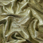 Draped Antique Gold Sheer Square Shimmer Stretch Tulle Fabric showing a geometric reflective grid across fluid folds