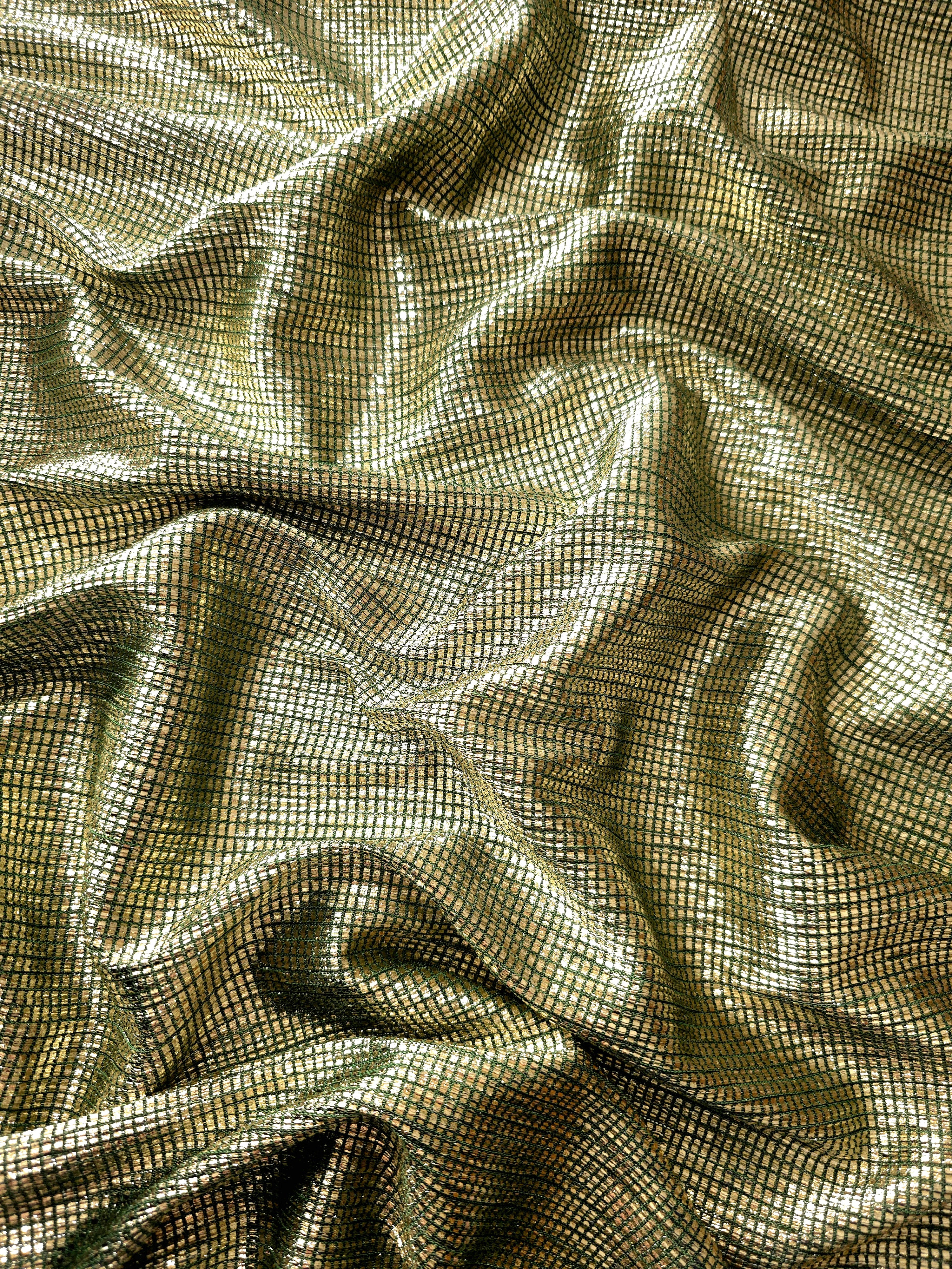 Draped Antique Gold Sheer Square Shimmer Stretch Tulle Fabric showing a geometric reflective grid across fluid folds