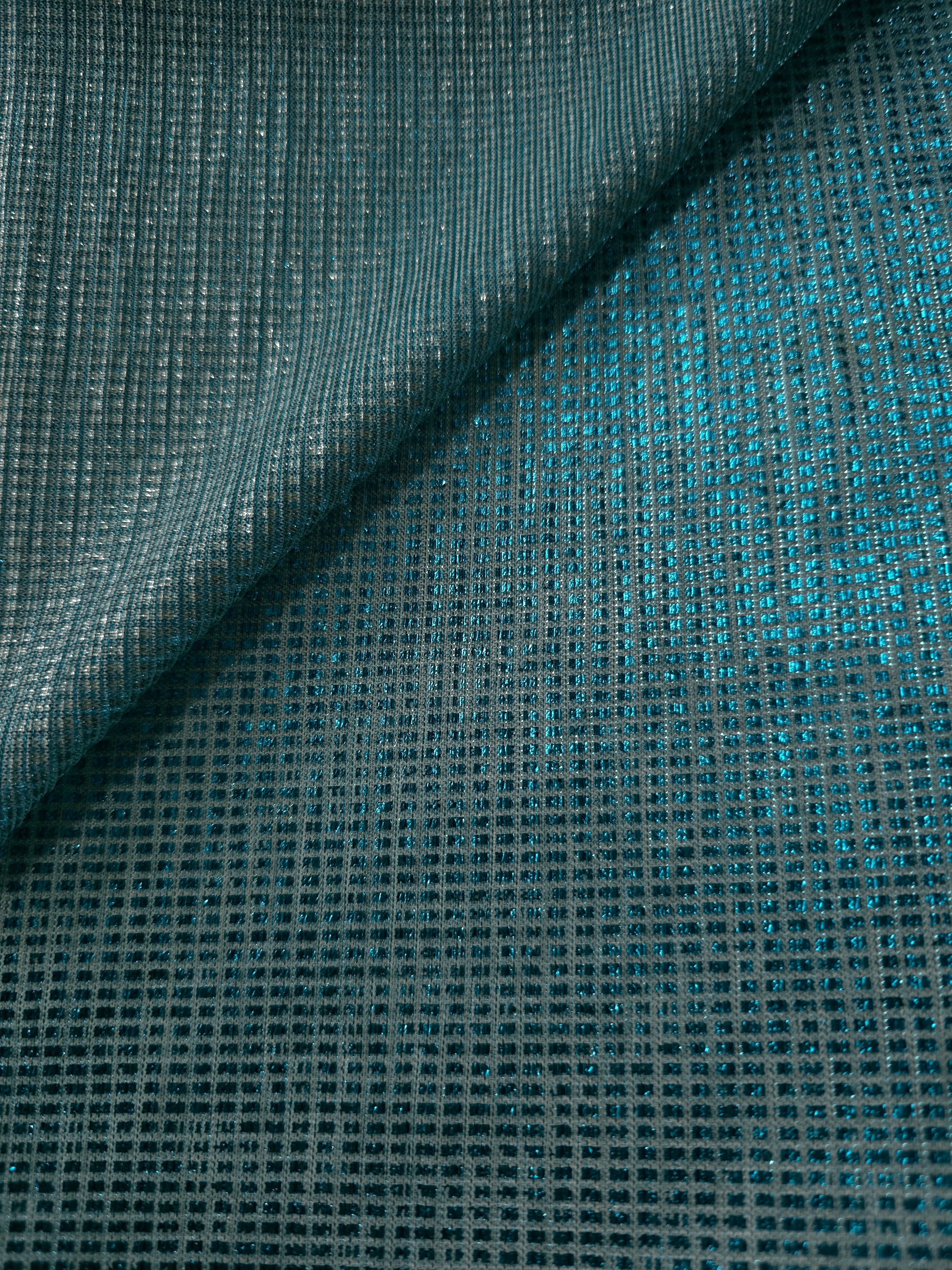Front and back of Aqua Teal Sheer Square Shimmer Stretch Tulle Fabric showing square motif, sheer knit base and flexible stretch