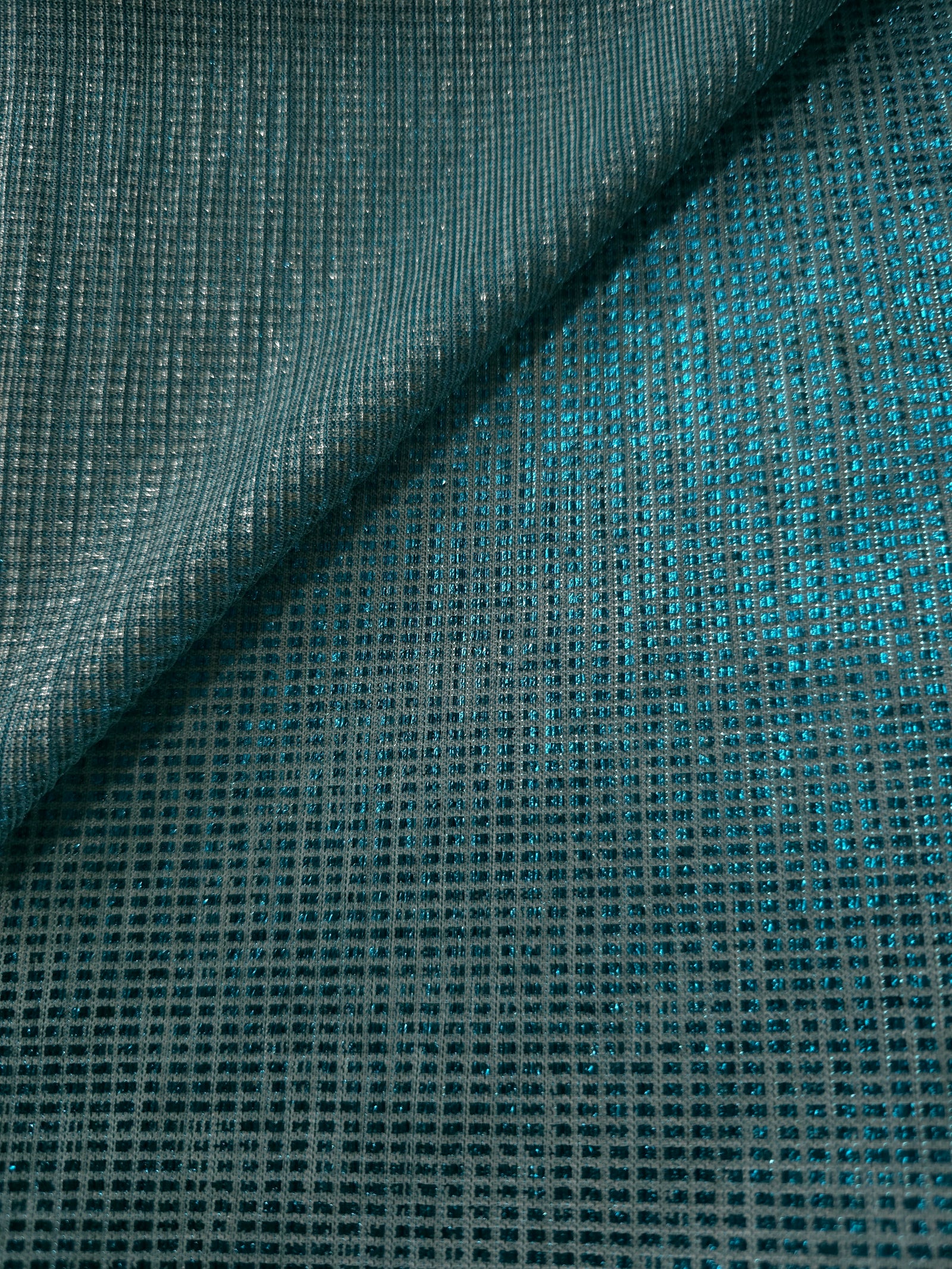 Front and back of Aqua Teal Sheer Square Shimmer Stretch Tulle Fabric showing square motif, sheer knit base and flexible stretch