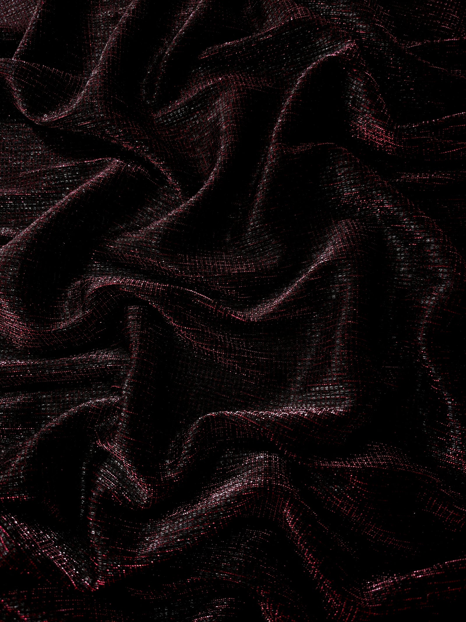 Draped Black Cherry Sheer Square Shimmer Stretch Tulle Fabric showing a geometric reflective grid across fluid folds