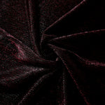 Swirl-draped Black Cherry Sheer Square Shimmer Stretch Tulle Fabric showing structured square reflections moving through soft folds