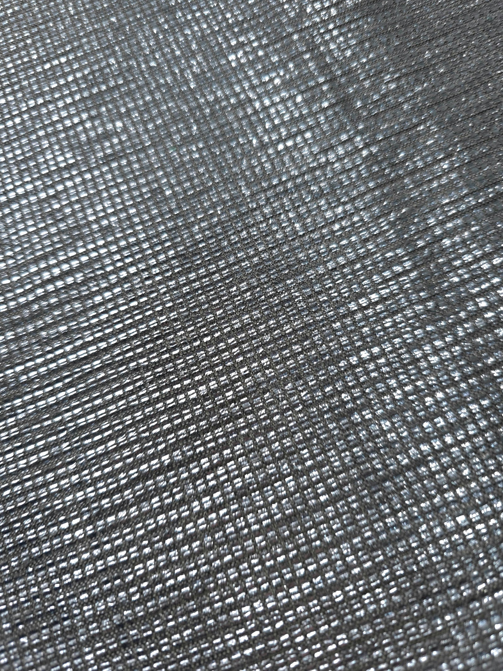 Close-up of Bright Silver Sheer Square Shimmer Stretch Tulle Fabric revealing the square shimmer repeat and fine transparent mesh