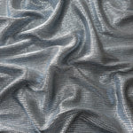 Draped Bright Silver Sheer Square Shimmer Stretch Tulle Fabric showing a geometric reflective grid across fluid folds
