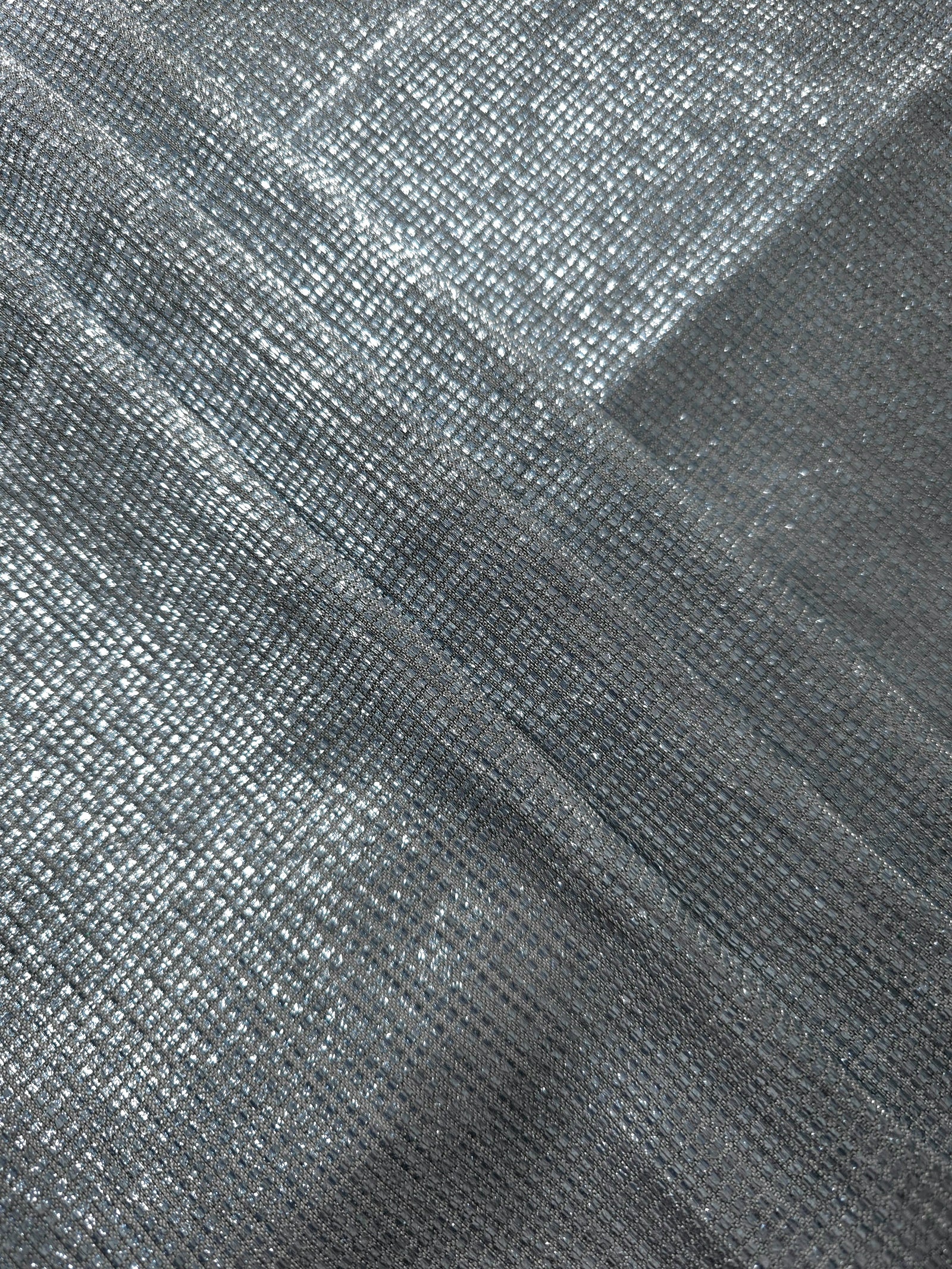Layered Bright Silver Sheer Square Shimmer Stretch Tulle Fabric showing overlapping geometry, denser shimmer and translucent depth