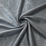 Swirl-draped Bright Silver Sheer Square Shimmer Stretch Tulle Fabric showing structured square reflections moving through soft folds