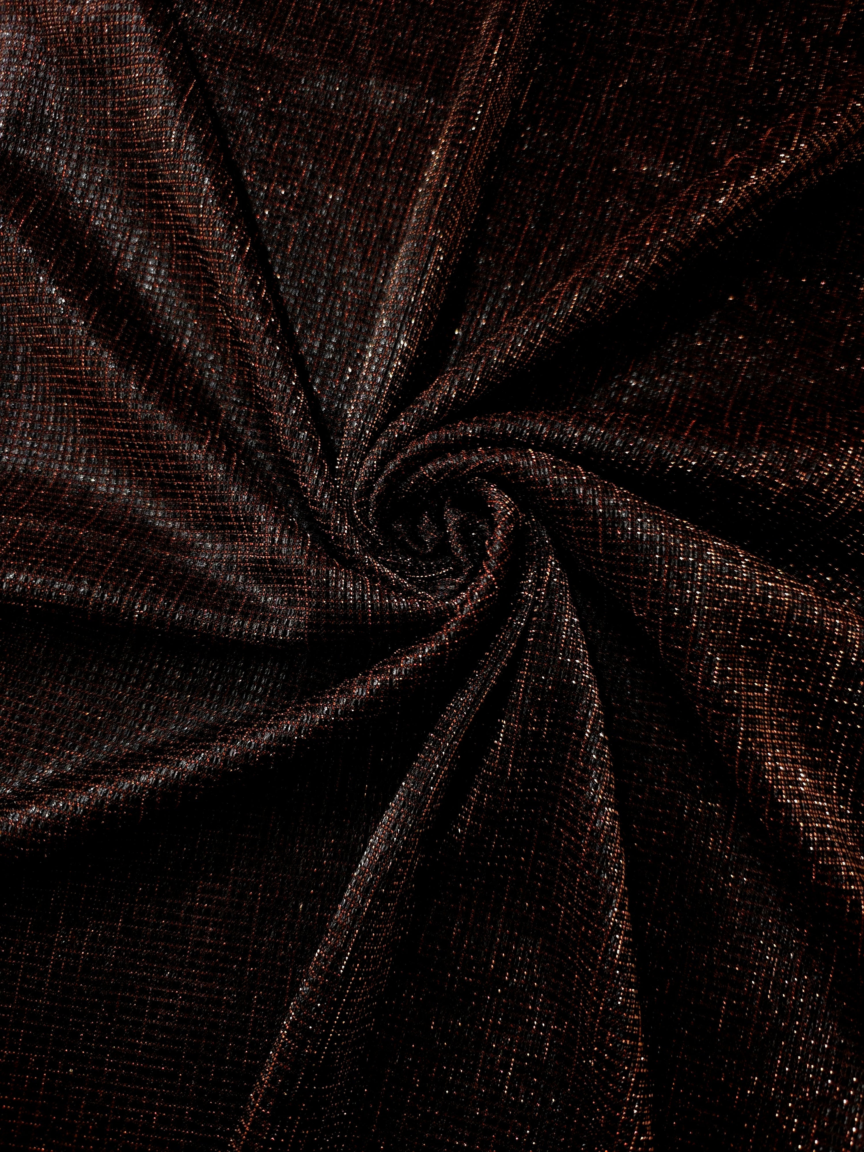 Swirl-draped Burnt Copper Sheer Square Shimmer Stretch Tulle Fabric showing structured square reflections moving through soft folds