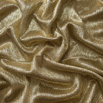 Draped Champagne Gold Sheer Square Shimmer Stretch Tulle Fabric showing a geometric reflective grid across fluid folds