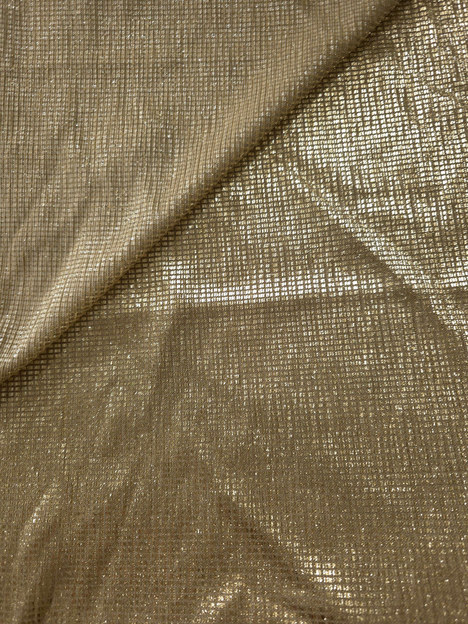 Front and back of Champagne Gold Sheer Square Shimmer Stretch Tulle Fabric showing square motif, sheer knit base and flexible stretch